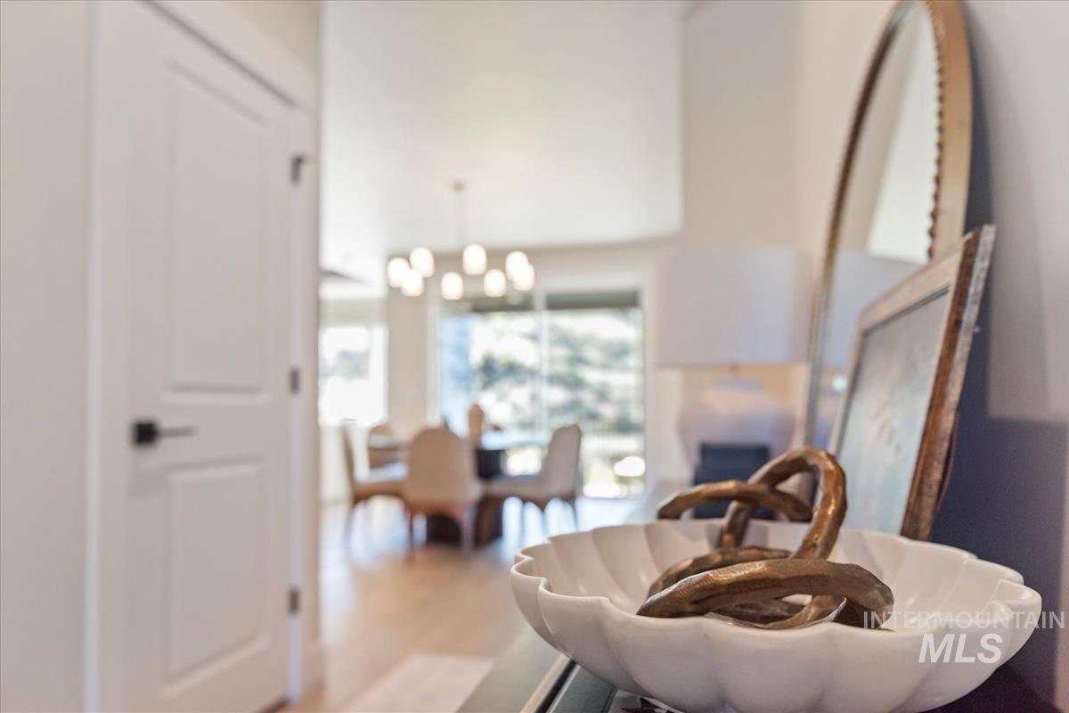 Living area featuring a chandelier and wood finished floors