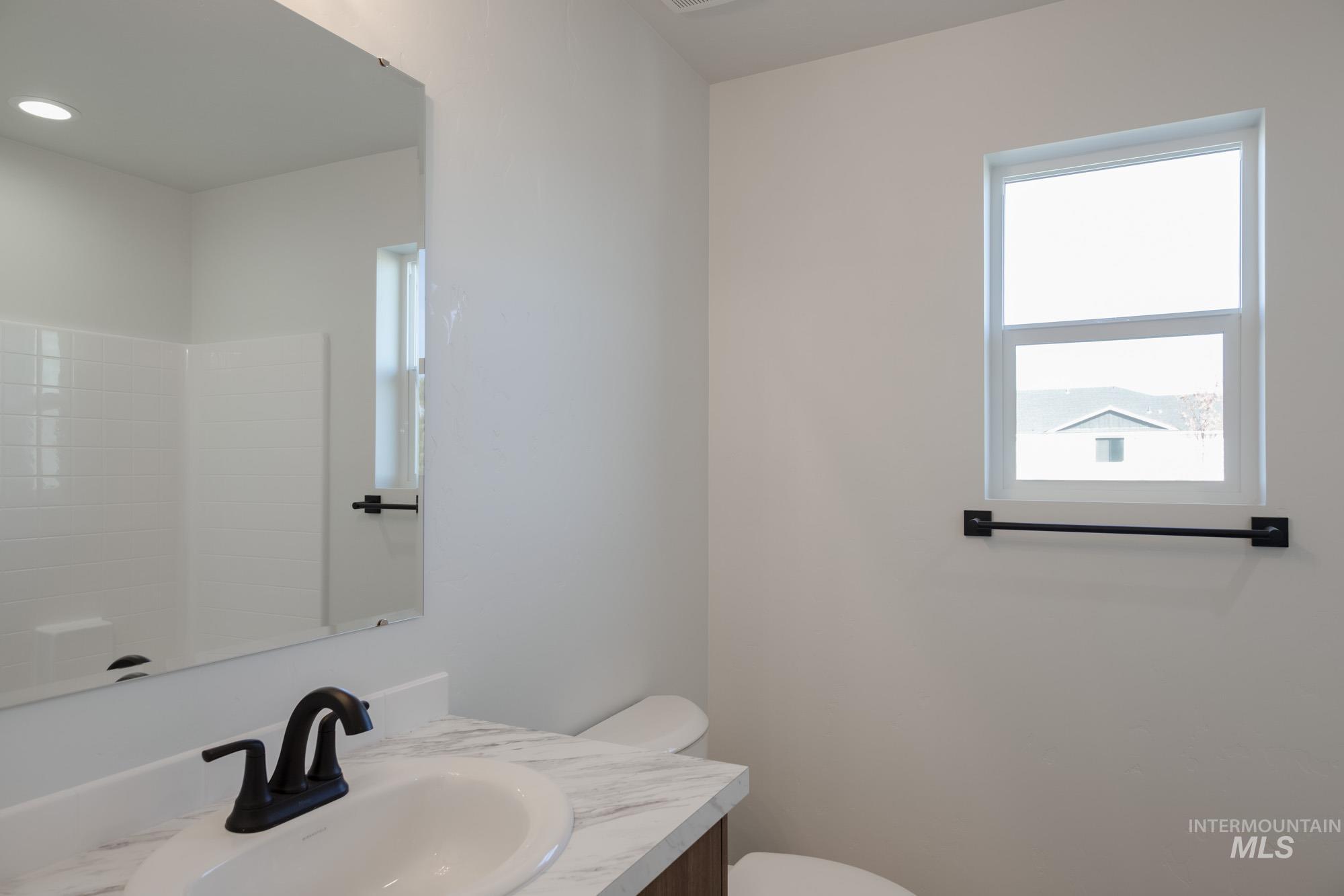 Bathroom with vanity and toilet