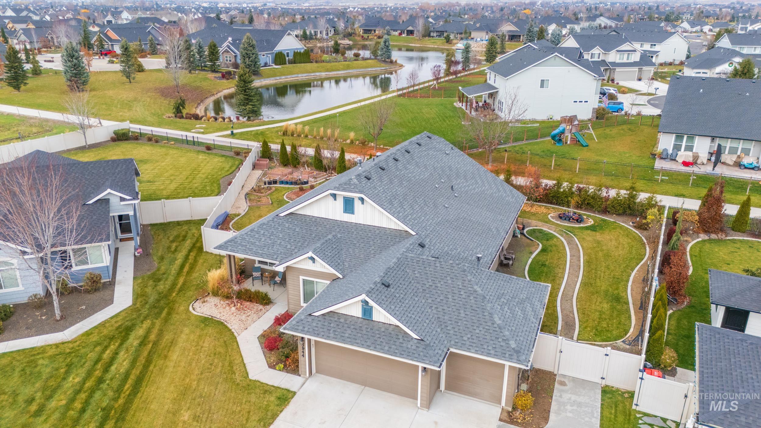 Aerial perspective of suburban area featuring a large body of water