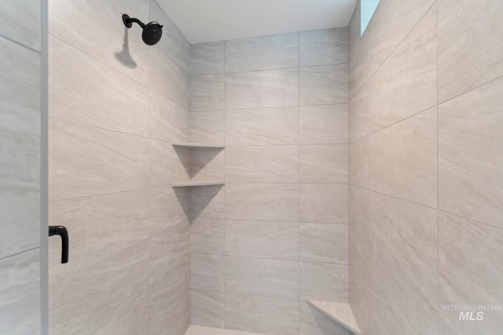 Full bathroom featuring a shower stall