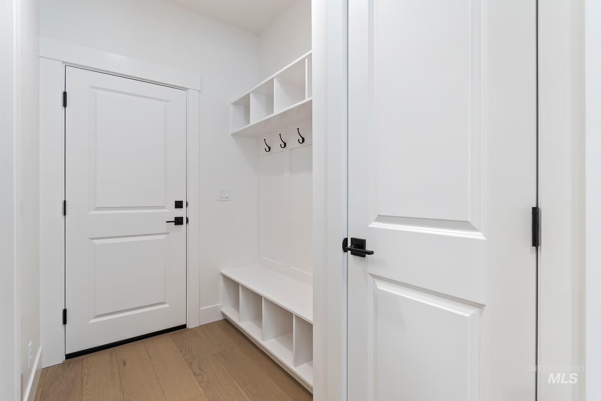 Mudroom with light wood-style floors