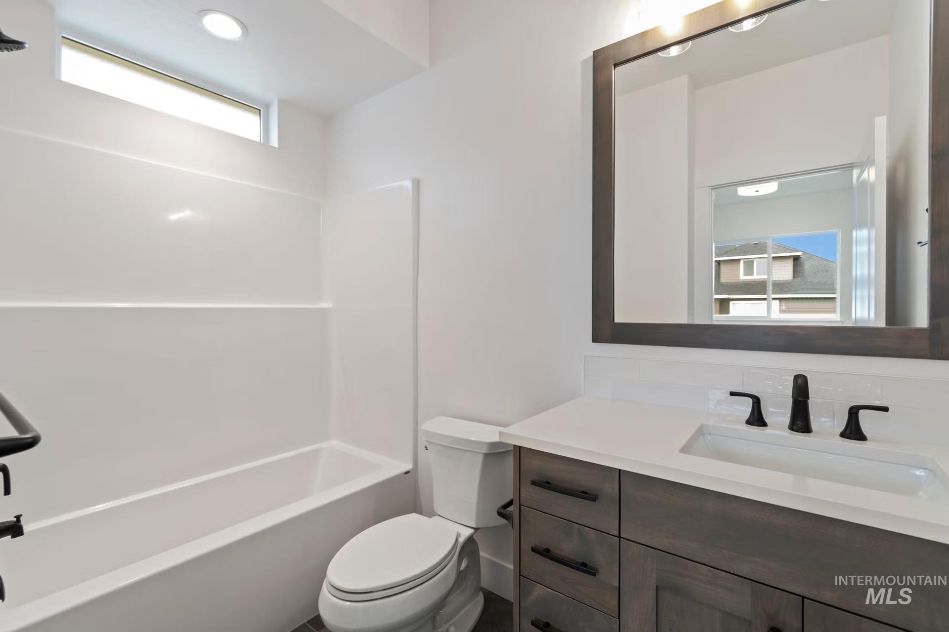 Full bathroom featuring vanity and bathtub / shower combination