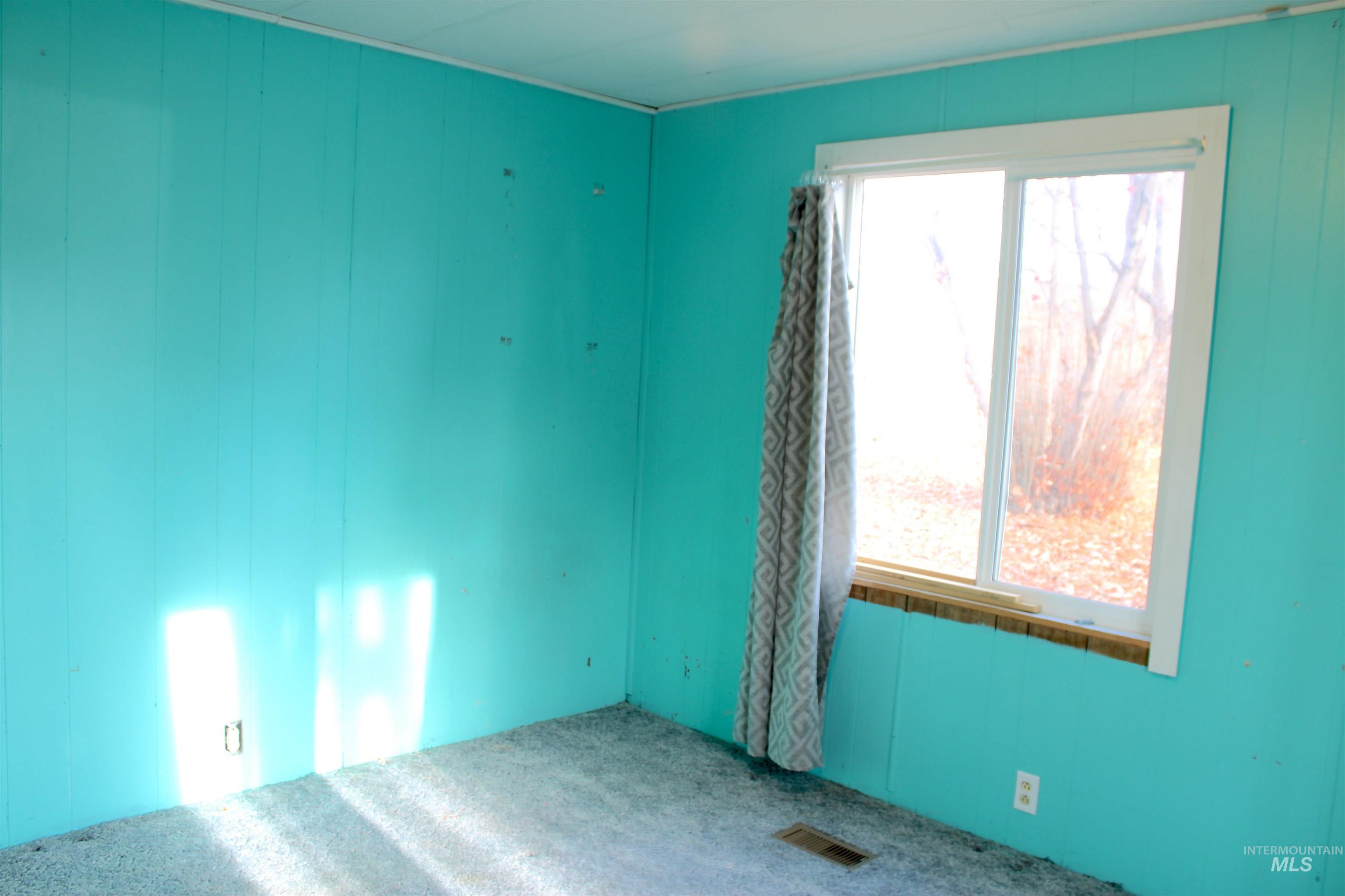 Empty room with wood walls