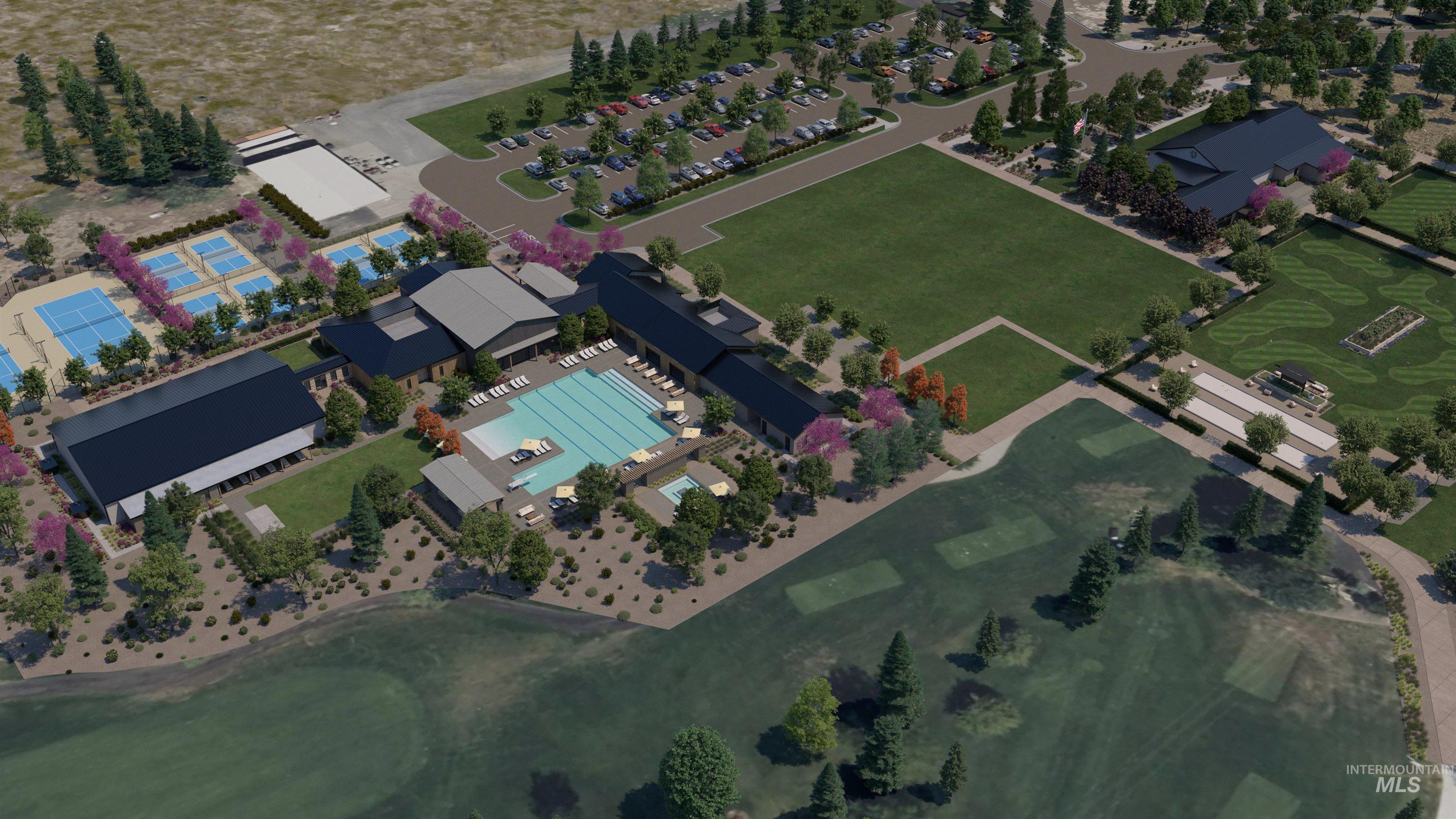Aerial view of property and surrounding area featuring a pool