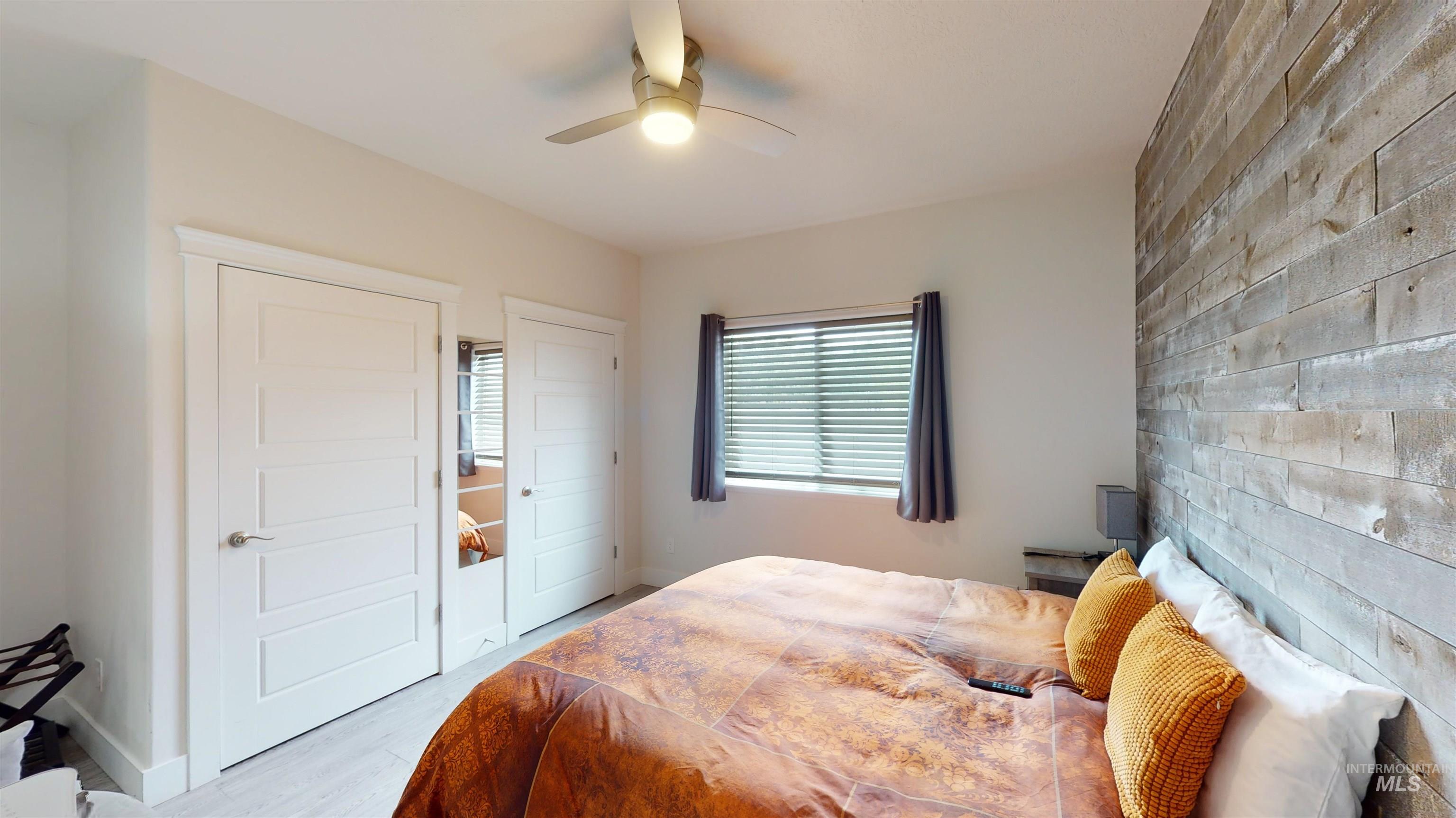 Bedroom featuring light wood-style flooring and ceiling fan