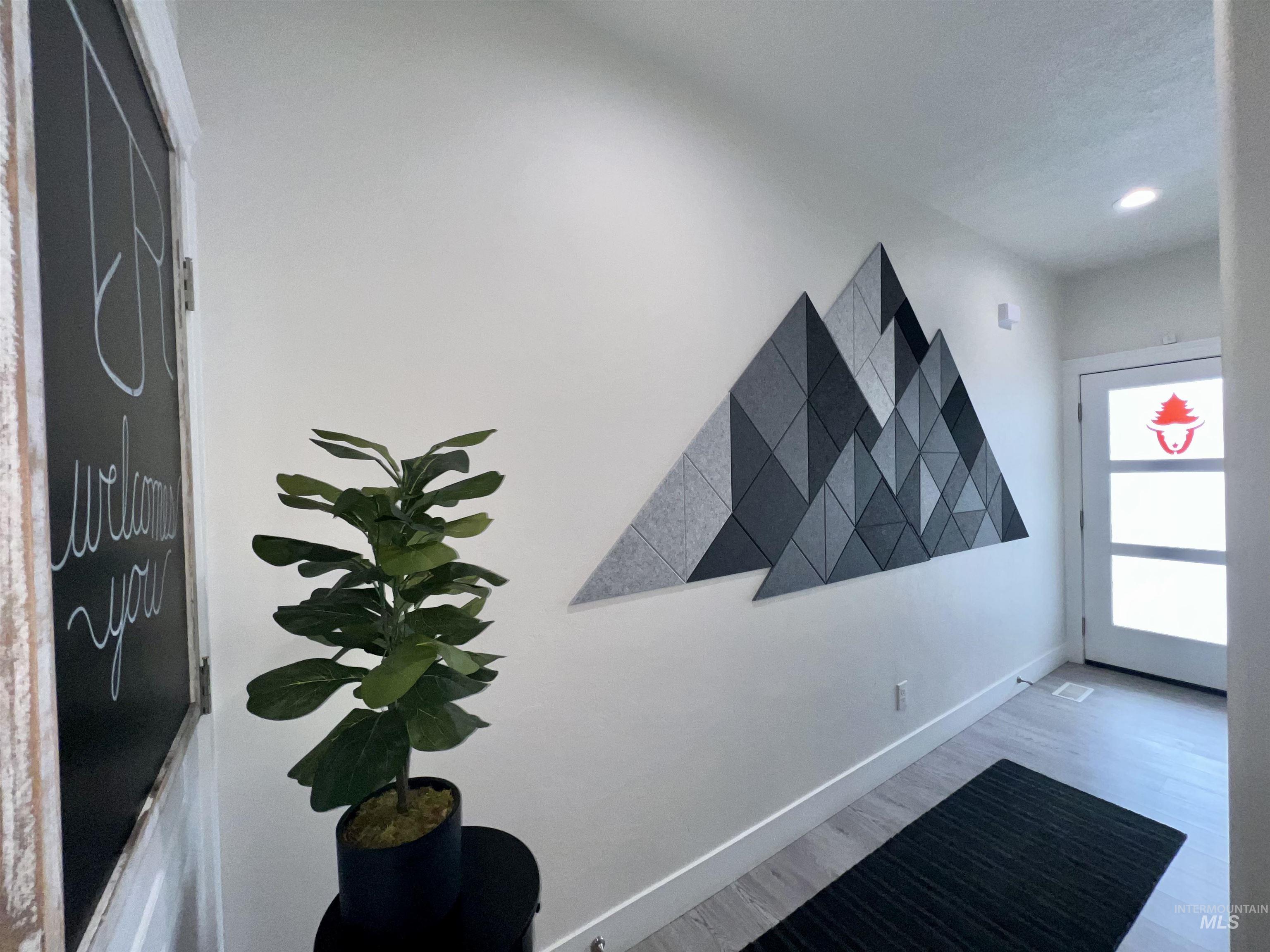 Detailed view of baseboards and recessed lighting