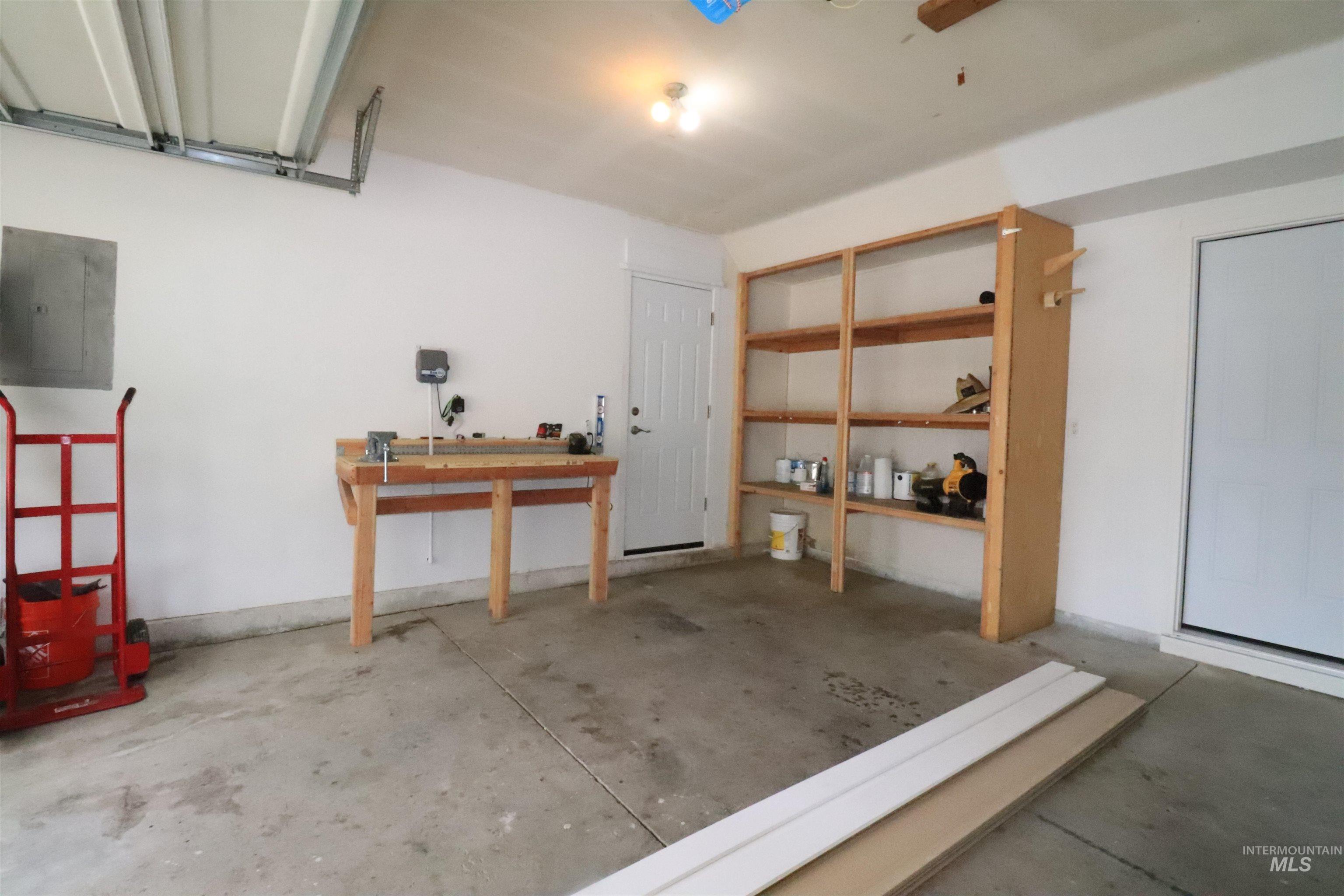 Garage featuring electric panel