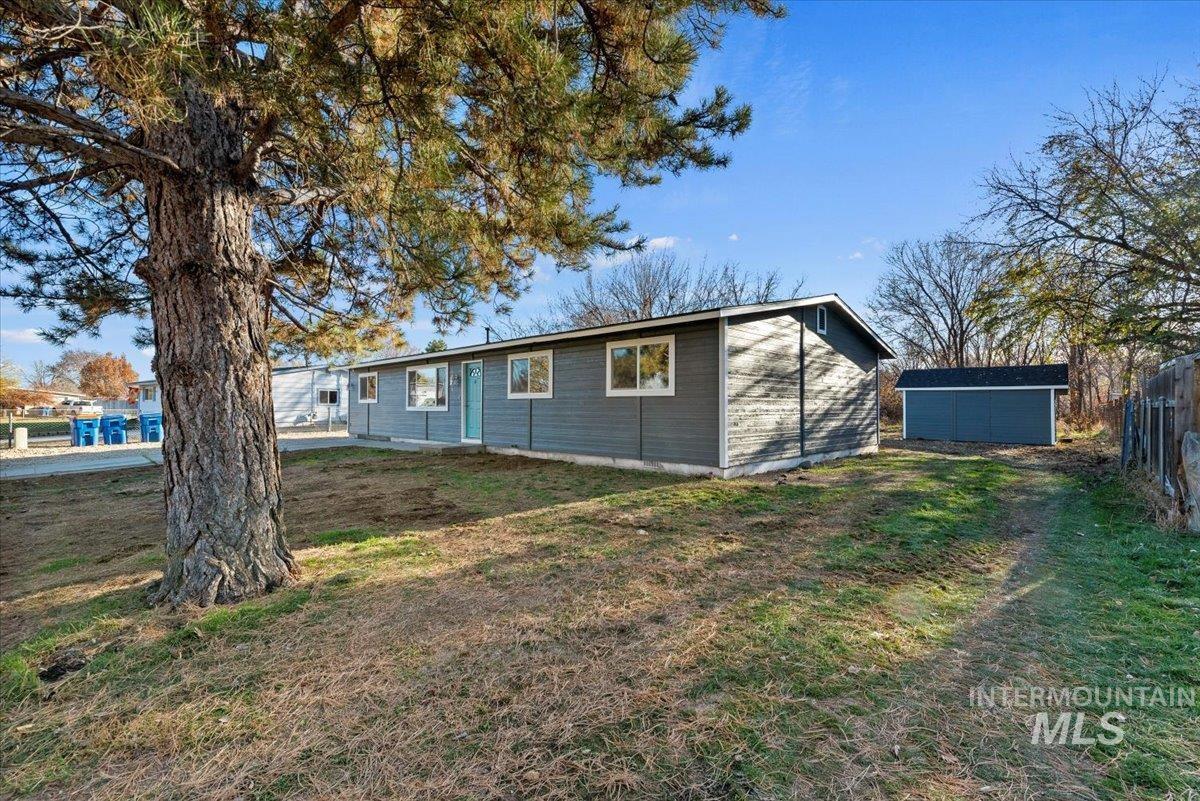View of front of house with an outbuilding