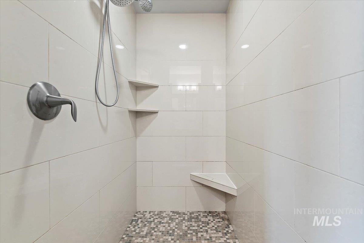 Full bathroom with a tile shower