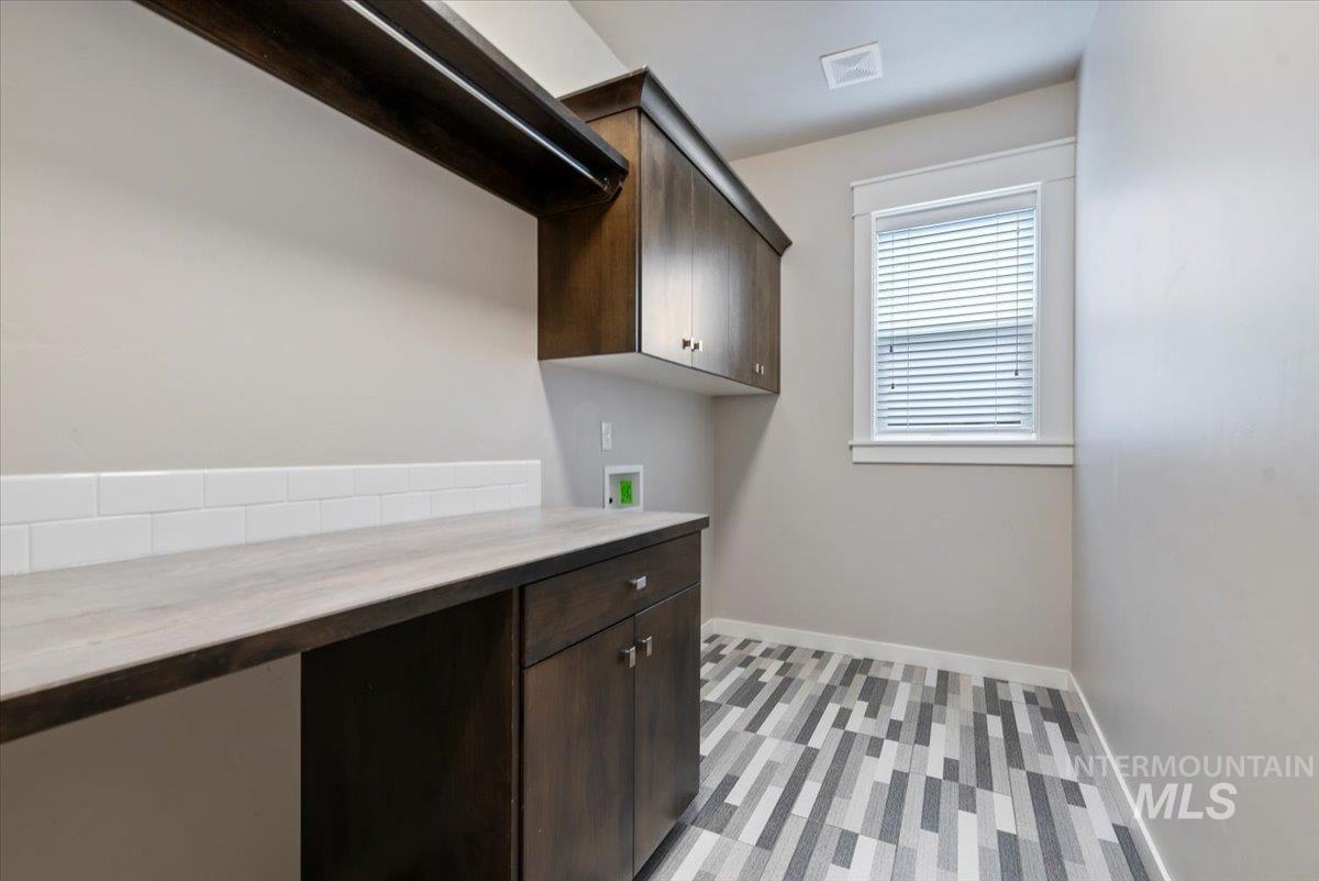 Laundry room with cabinet space and washer hookup