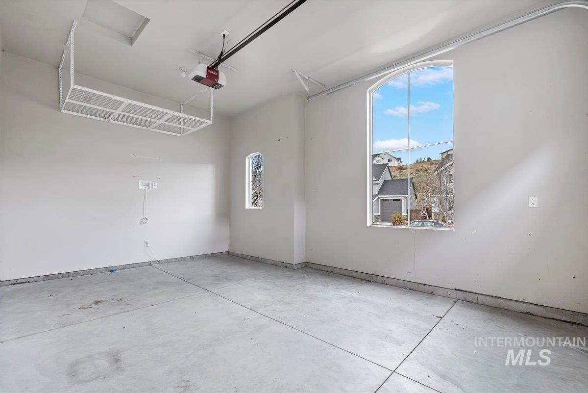 Garage featuring a garage door opener