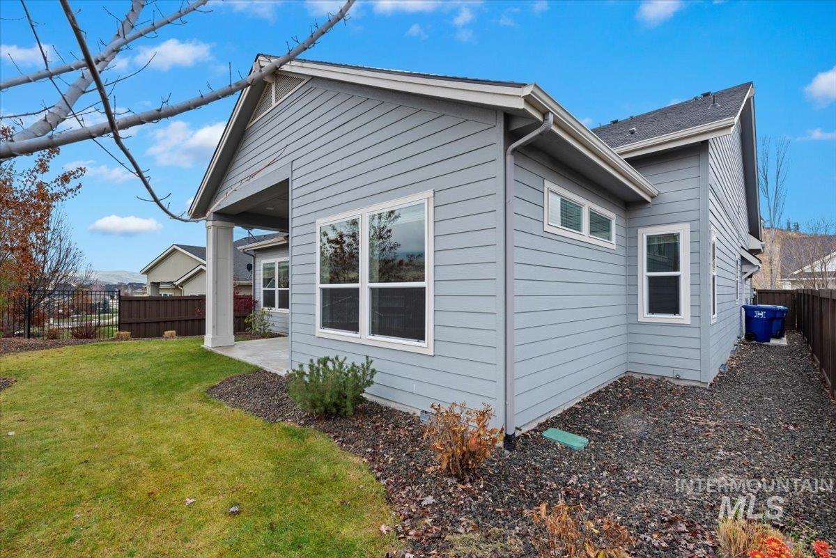 View of side of property with a patio
