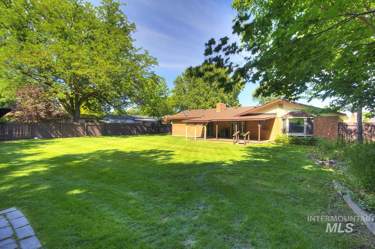 Fenced backyard with a patio