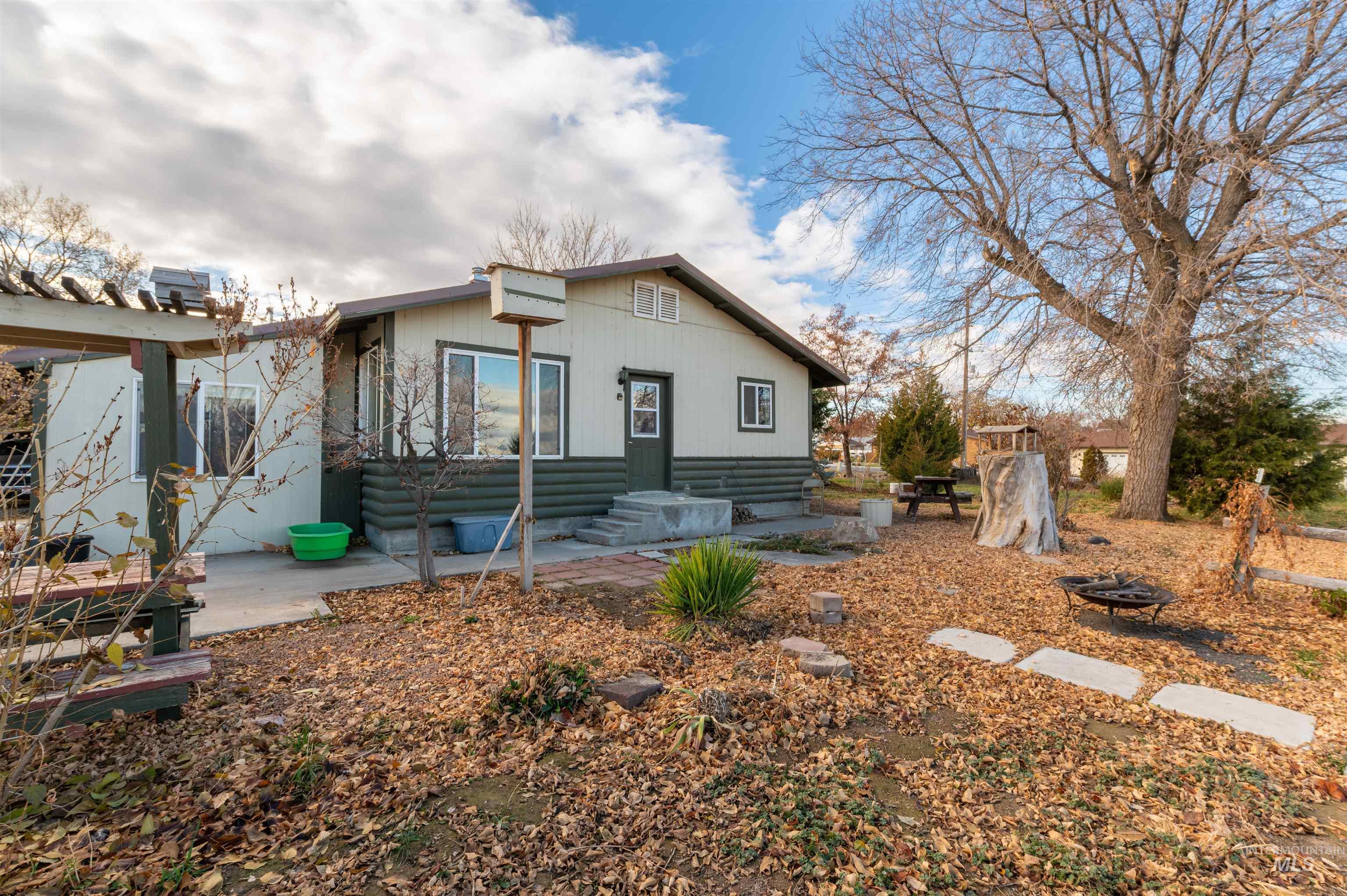 Bungalow featuring a patio