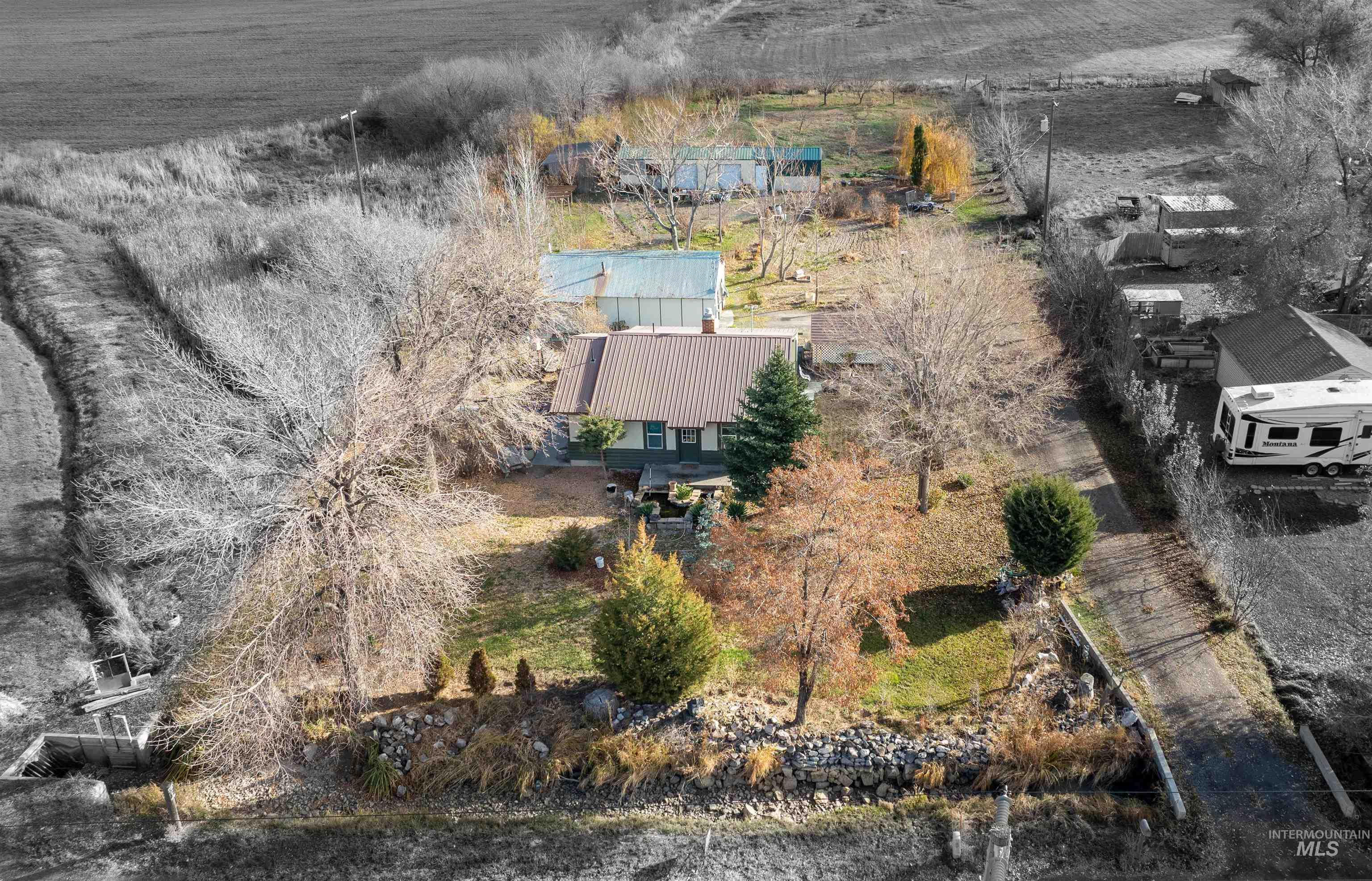 Aerial view of property and surrounding area with rural landscape