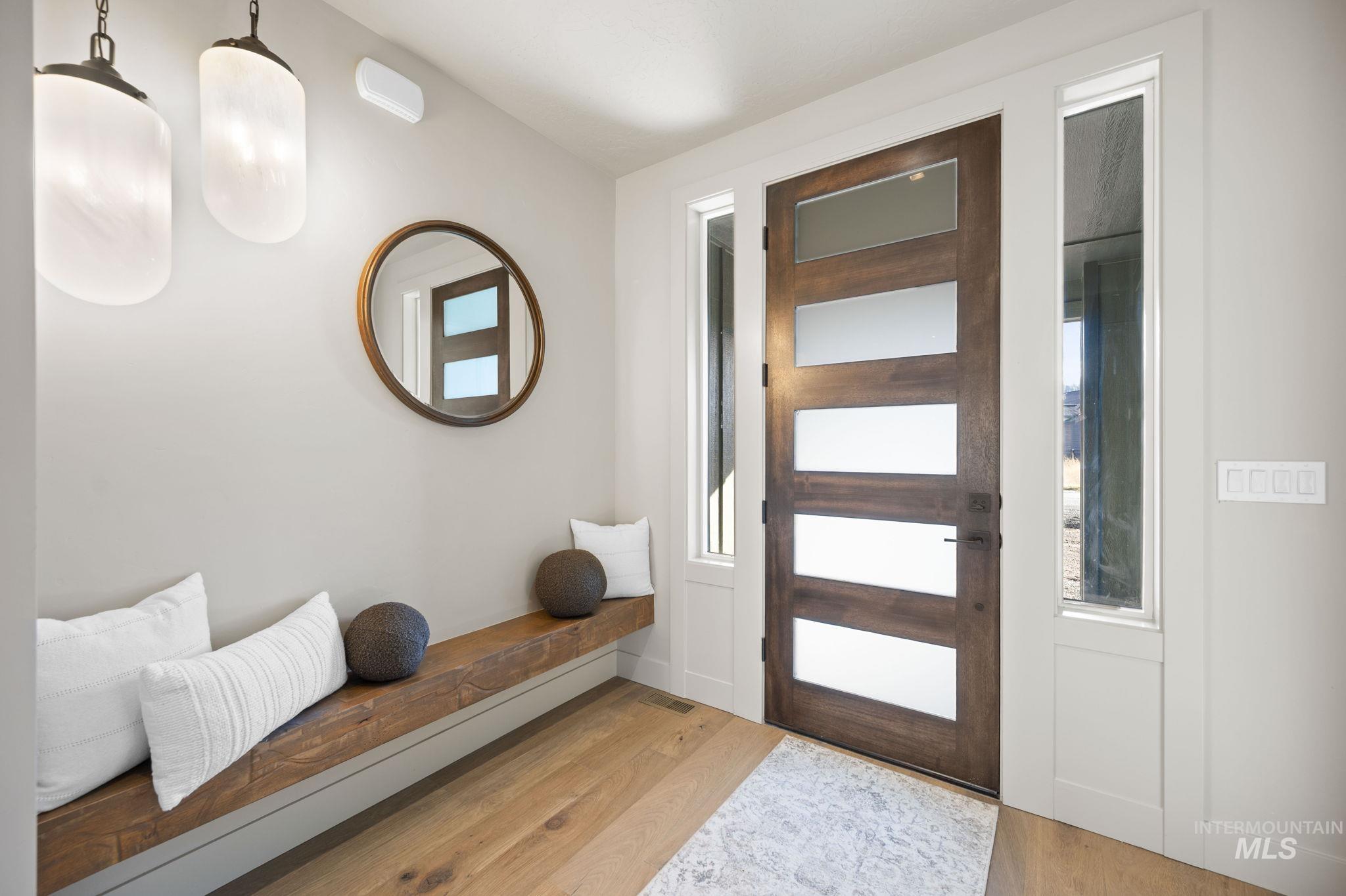 Entryway with wood finished floors