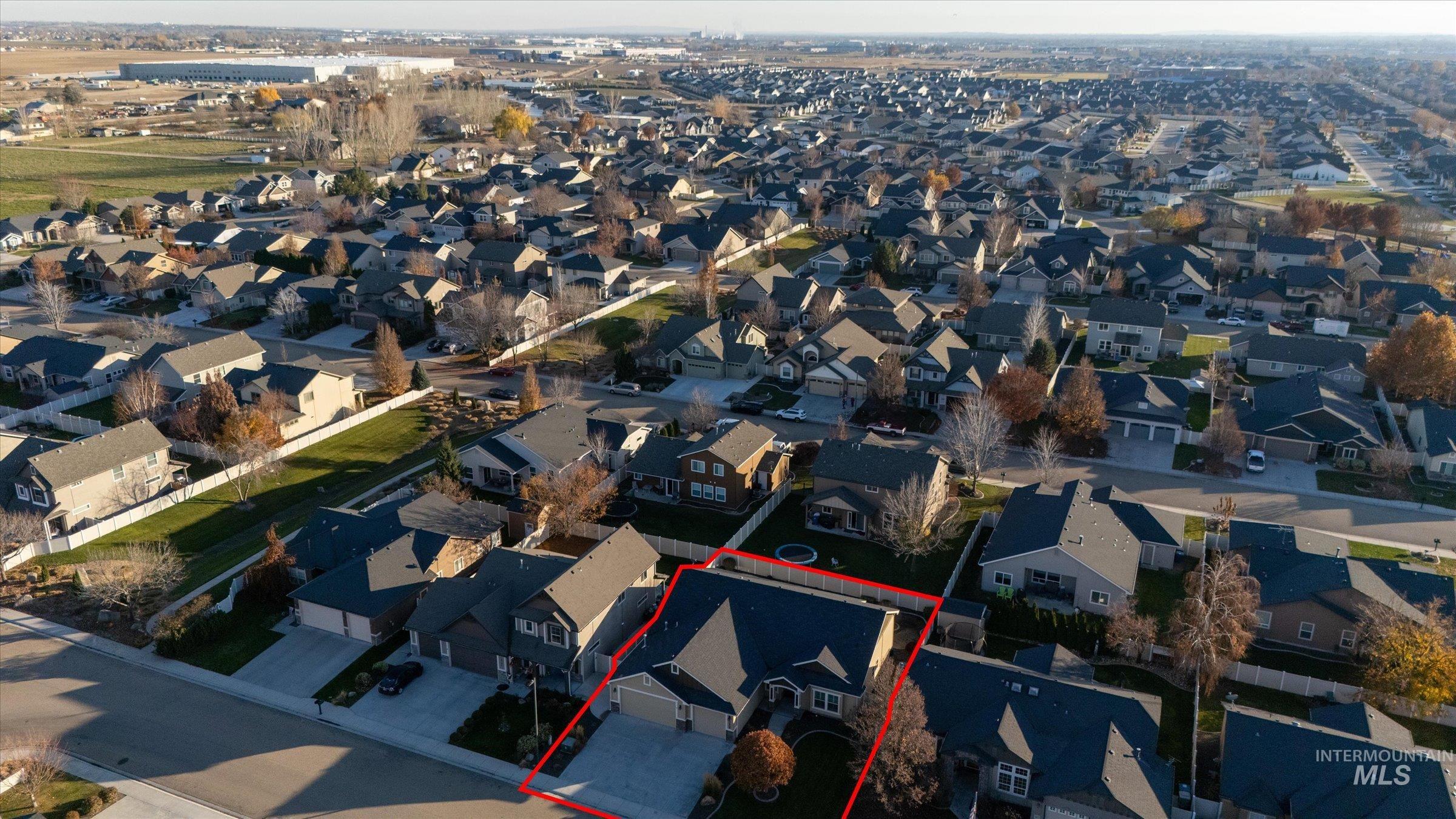 Aerial perspective of suburban area with property parcel outlined