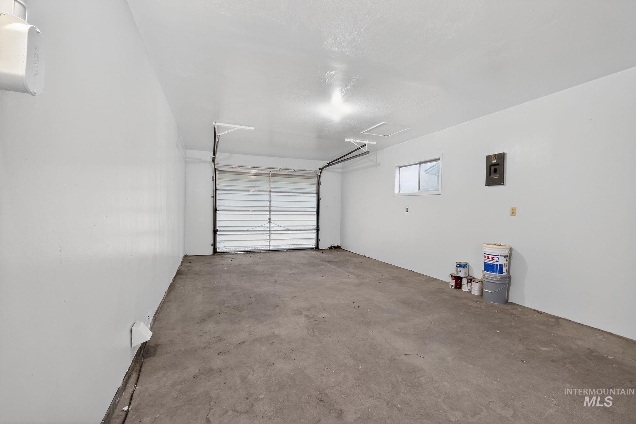 Garage featuring electric panel
