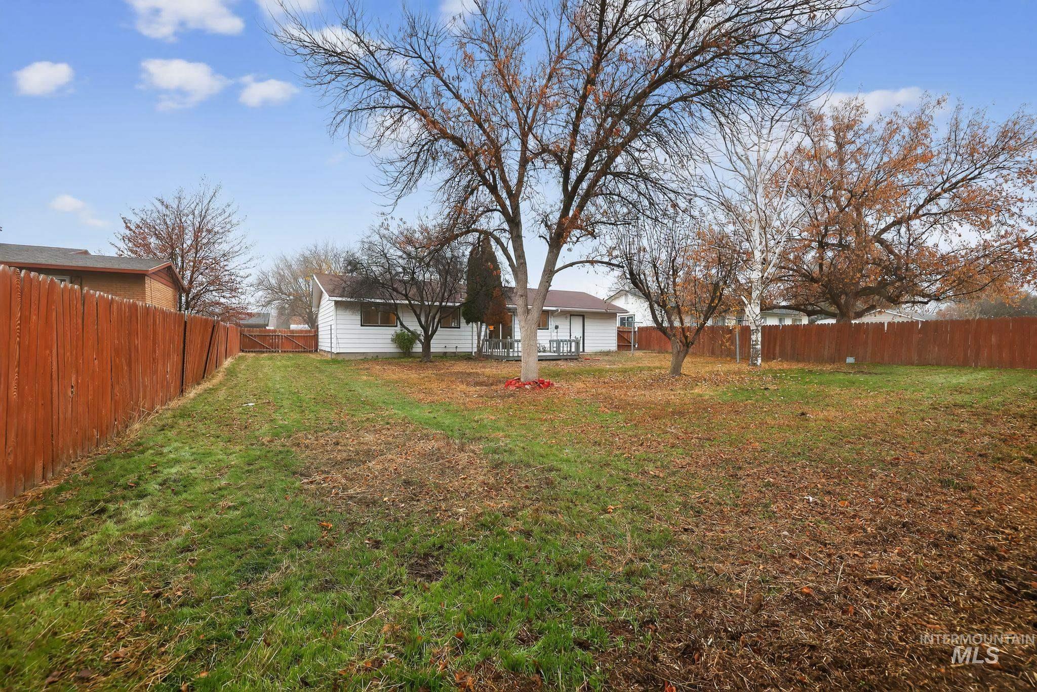 View of fenced backyard