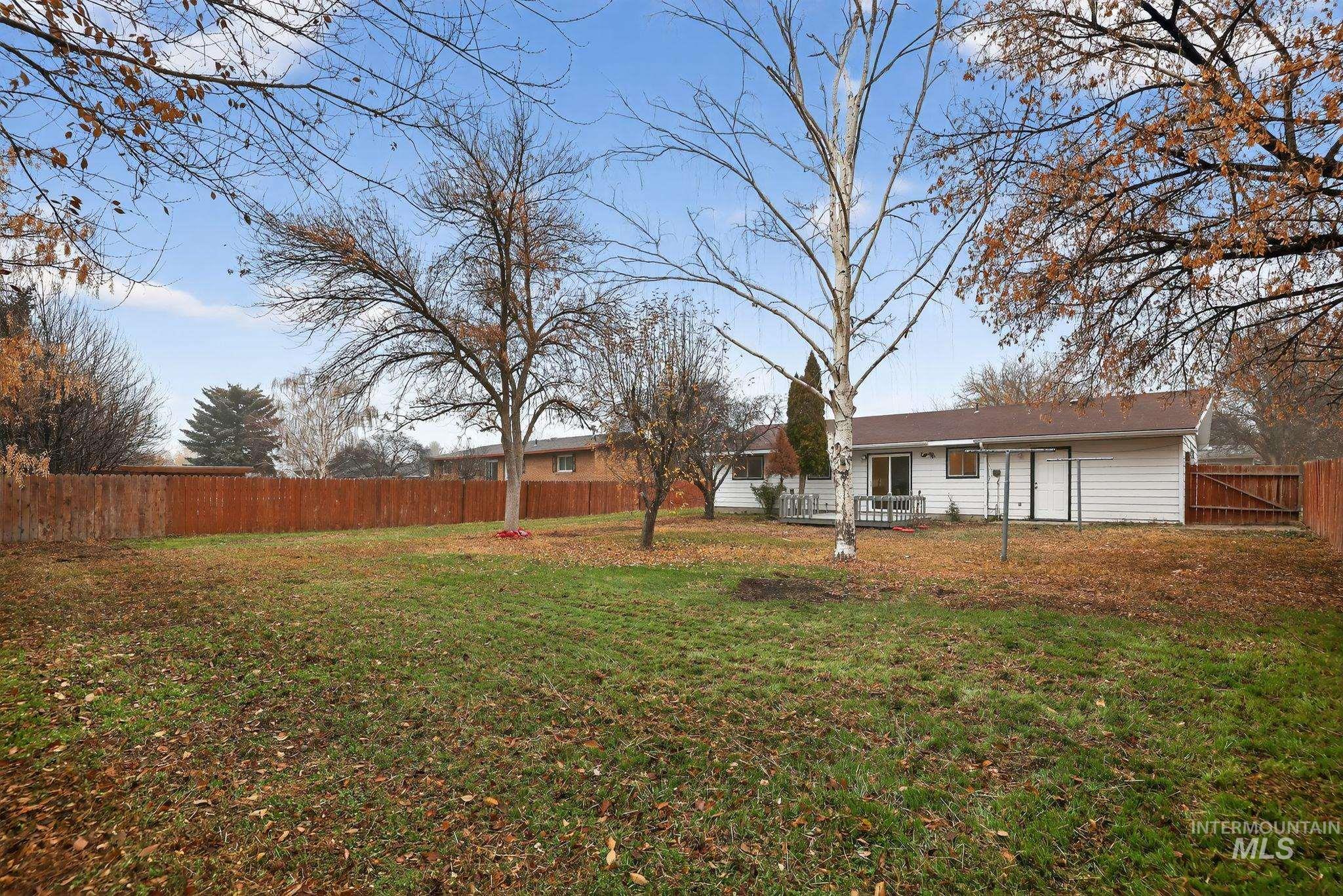 View of fenced backyard