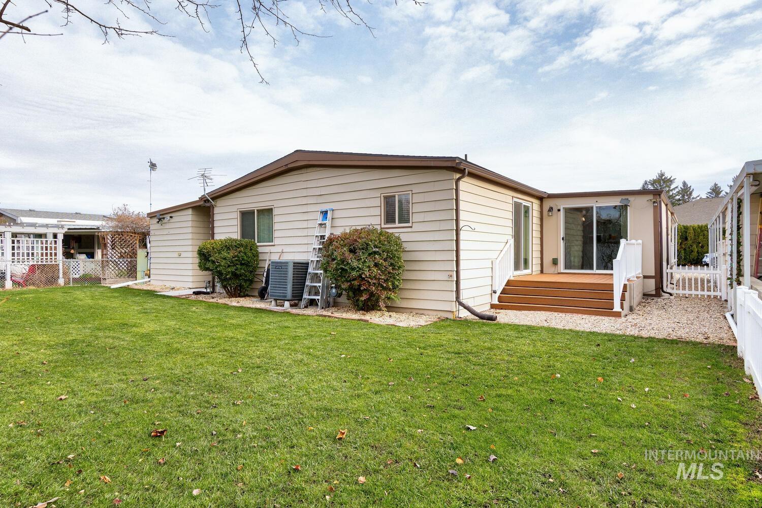 Back of house with a wooden deck