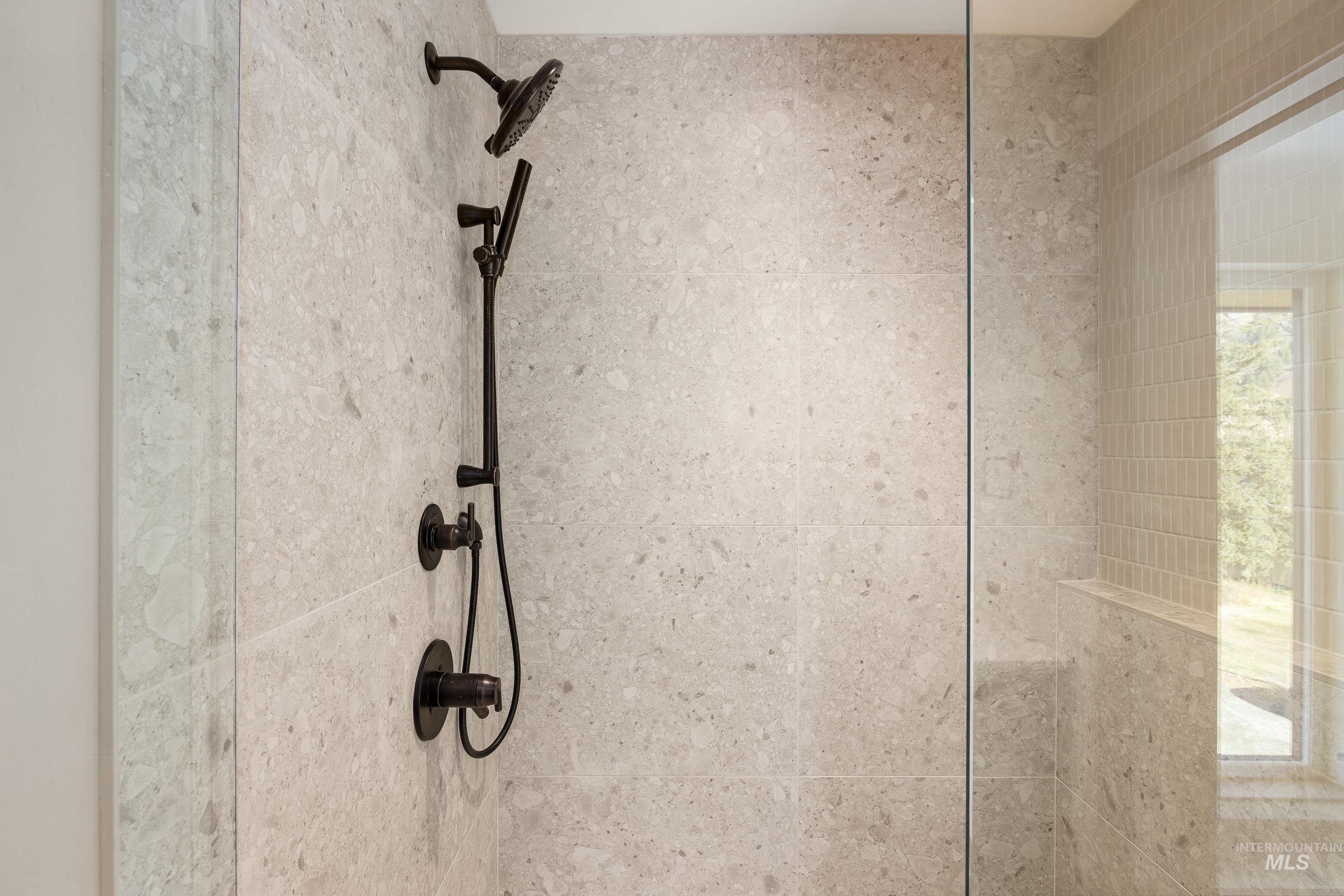 Bathroom view of a tile shower