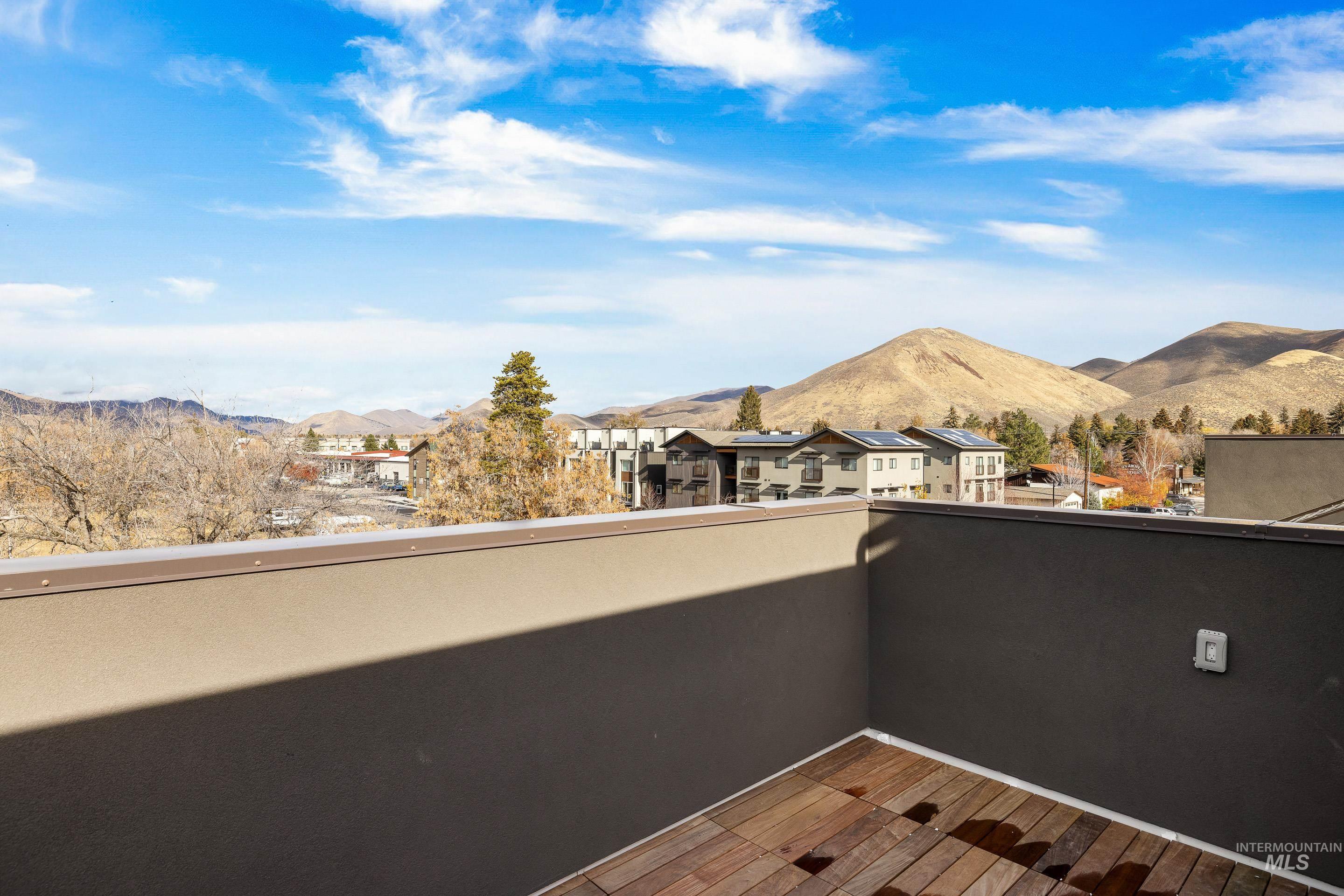 Balcony with a mountain view and a residential view