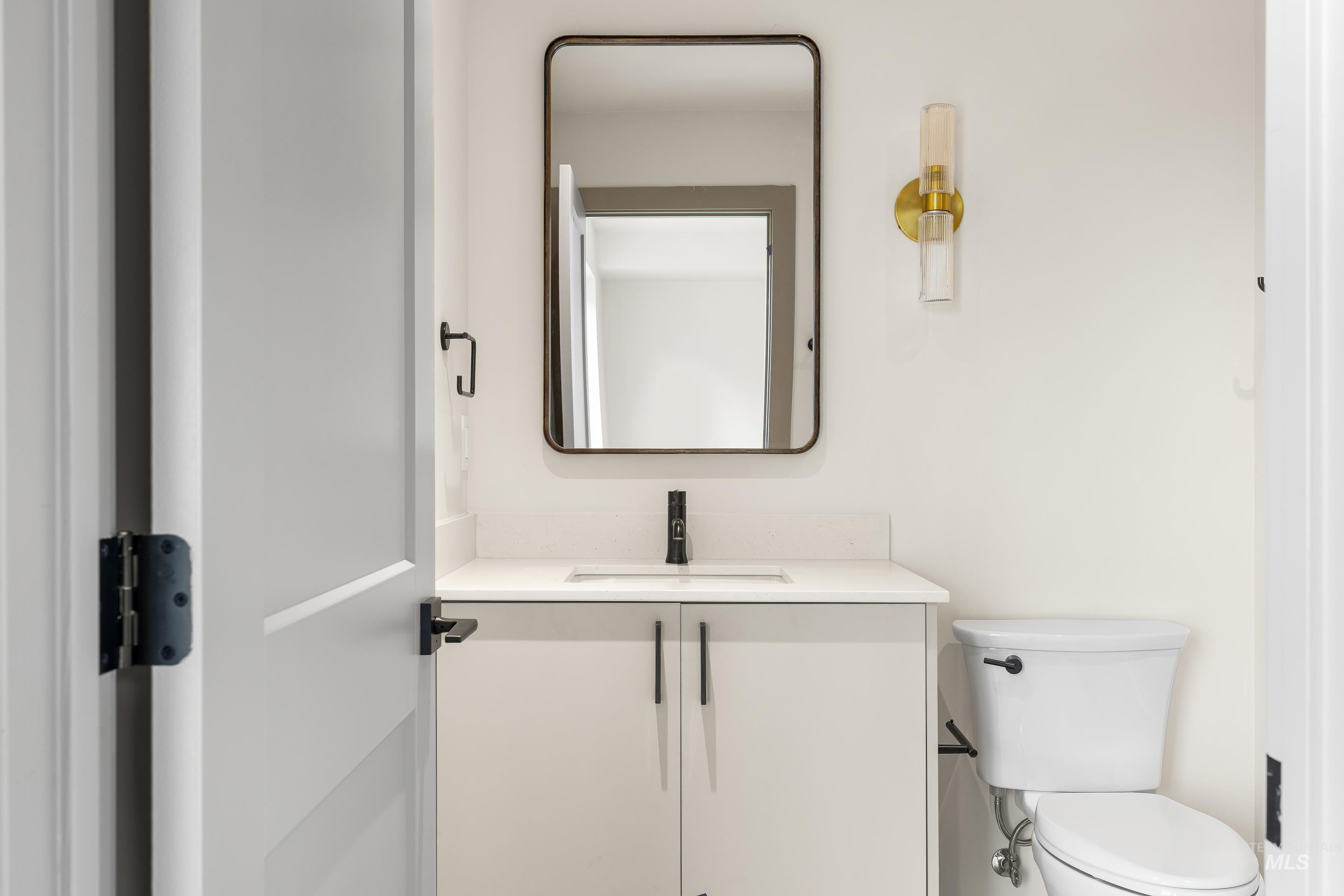 Bathroom with vanity and toilet