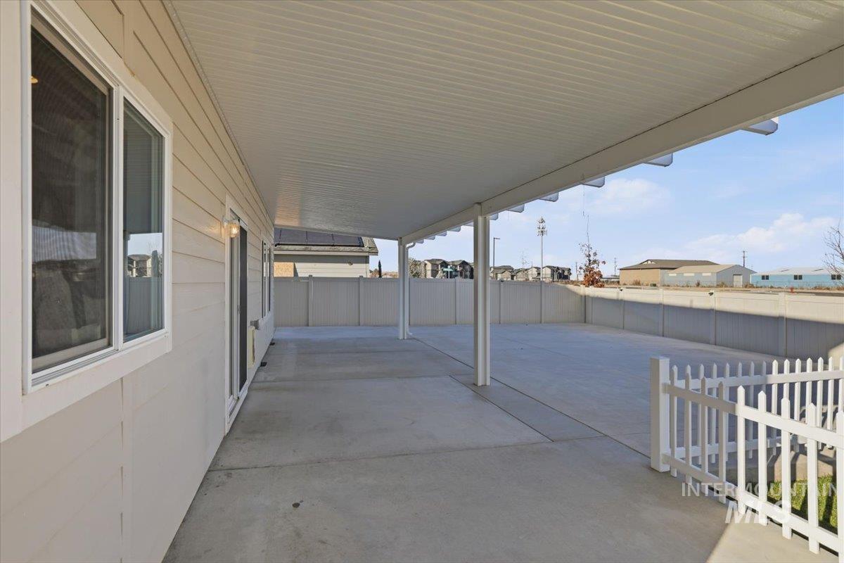 Fenced backyard featuring a patio area
