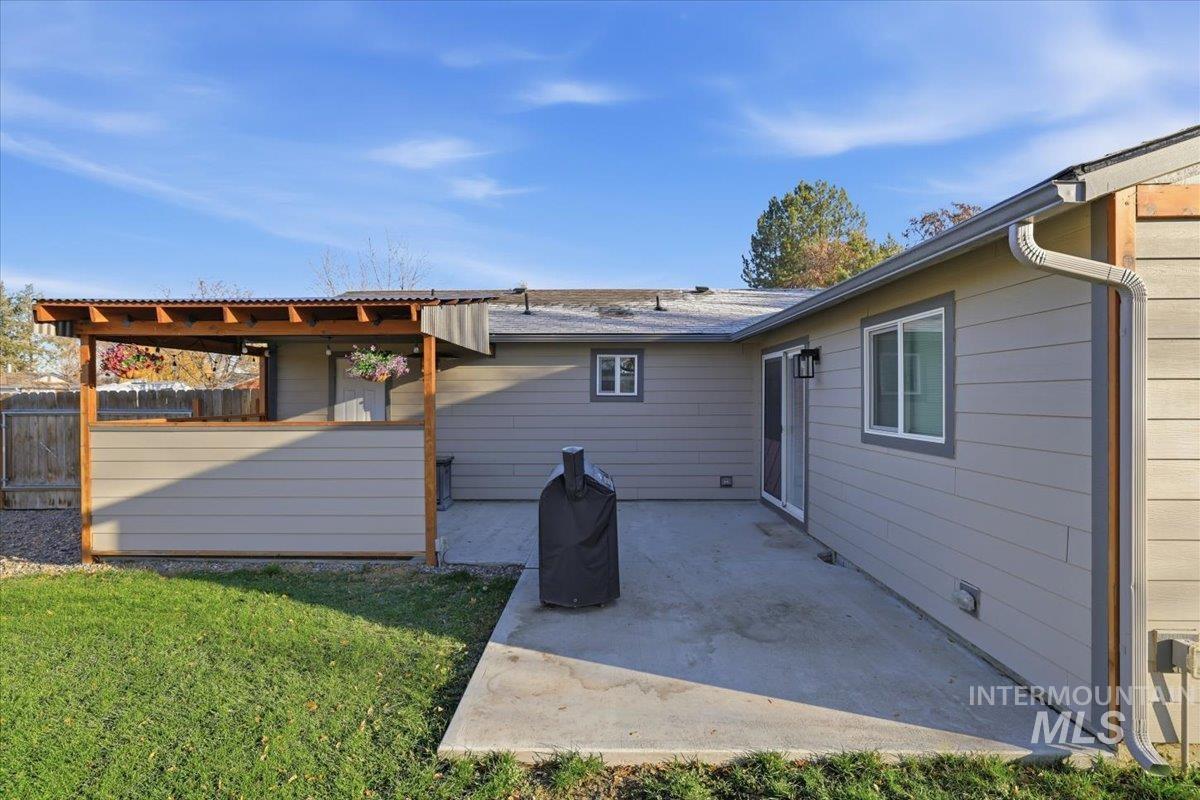 Rear view of property featuring a patio area