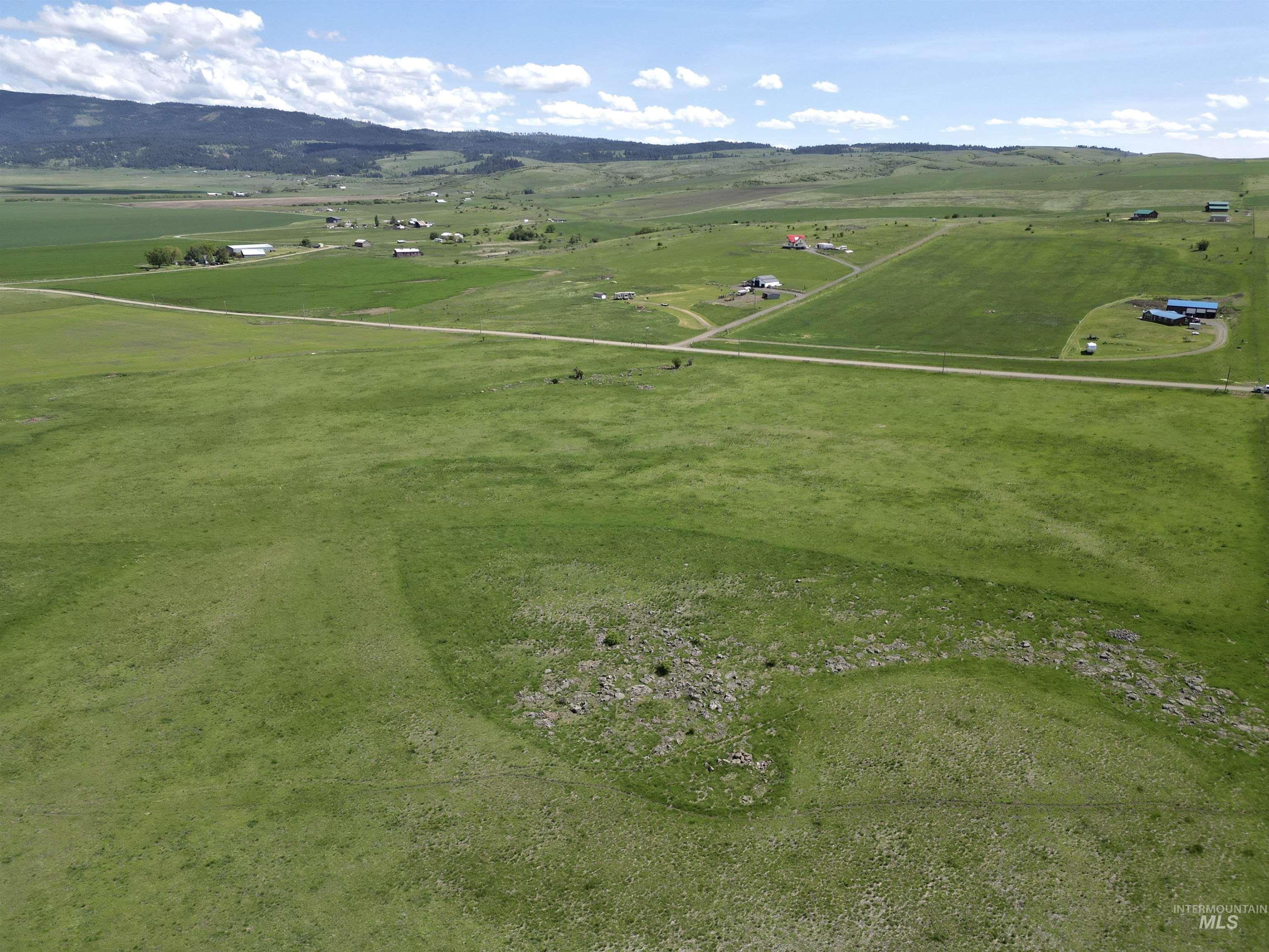 Aerial view of sparsely populated area with a mountain backdrop