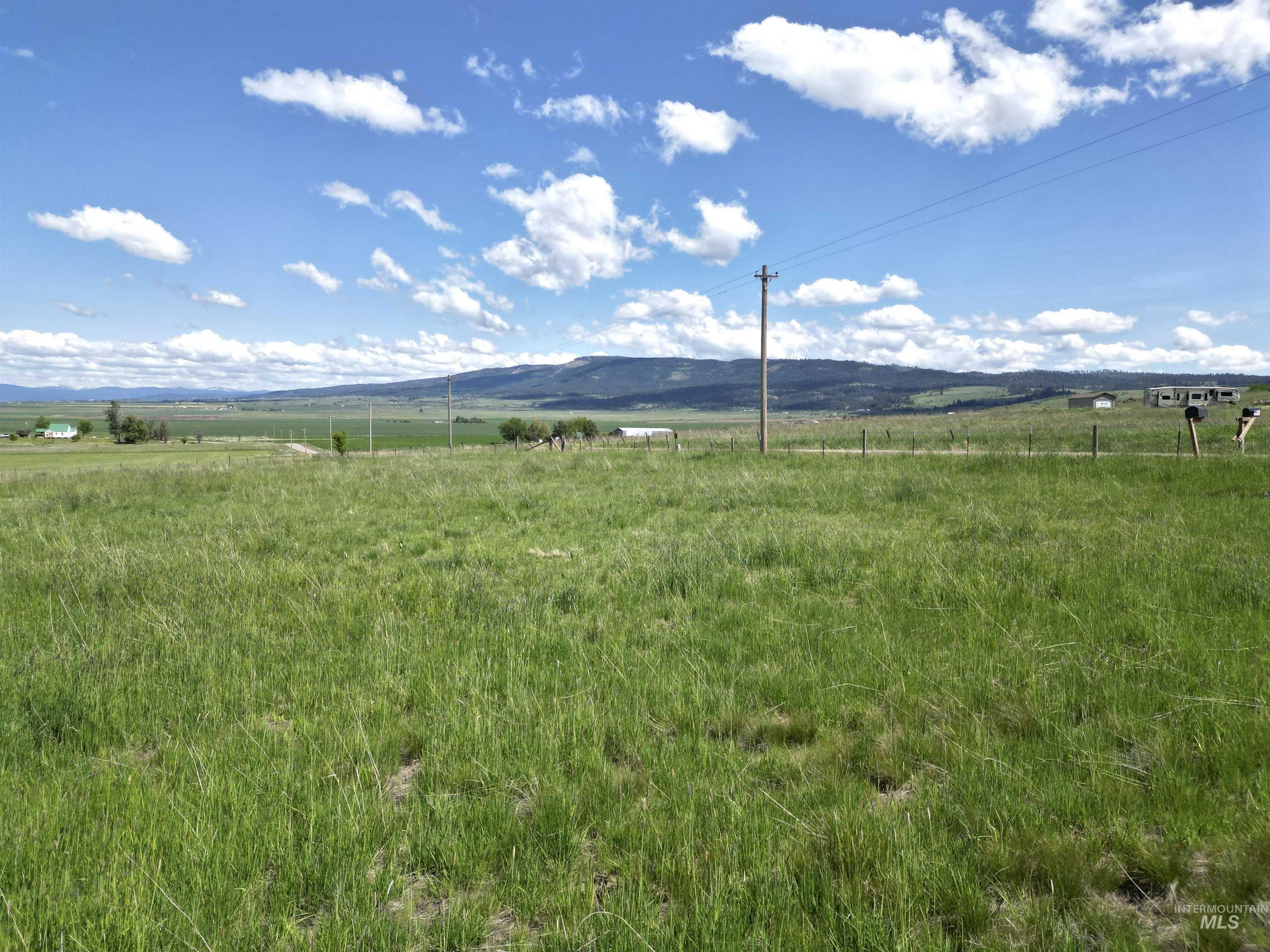 View of mountain backdrop with rural landscape