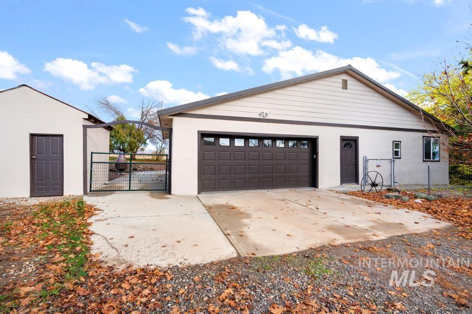 Garage with a gate and driveway
