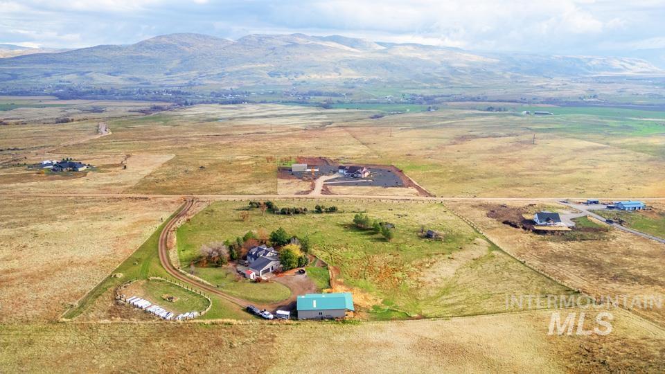 Aerial view of sparsely populated area with a mountain backdrop