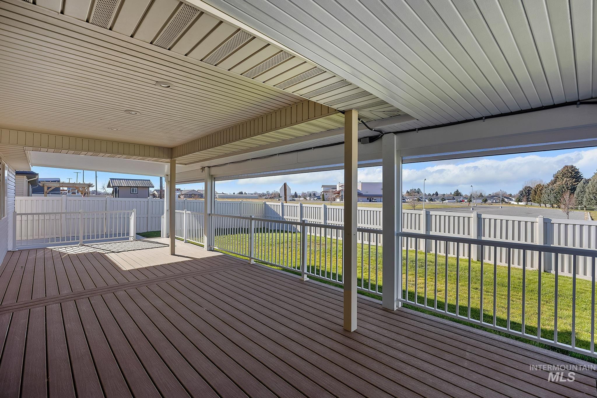 Deck featuring a residential view and a fenced backyard