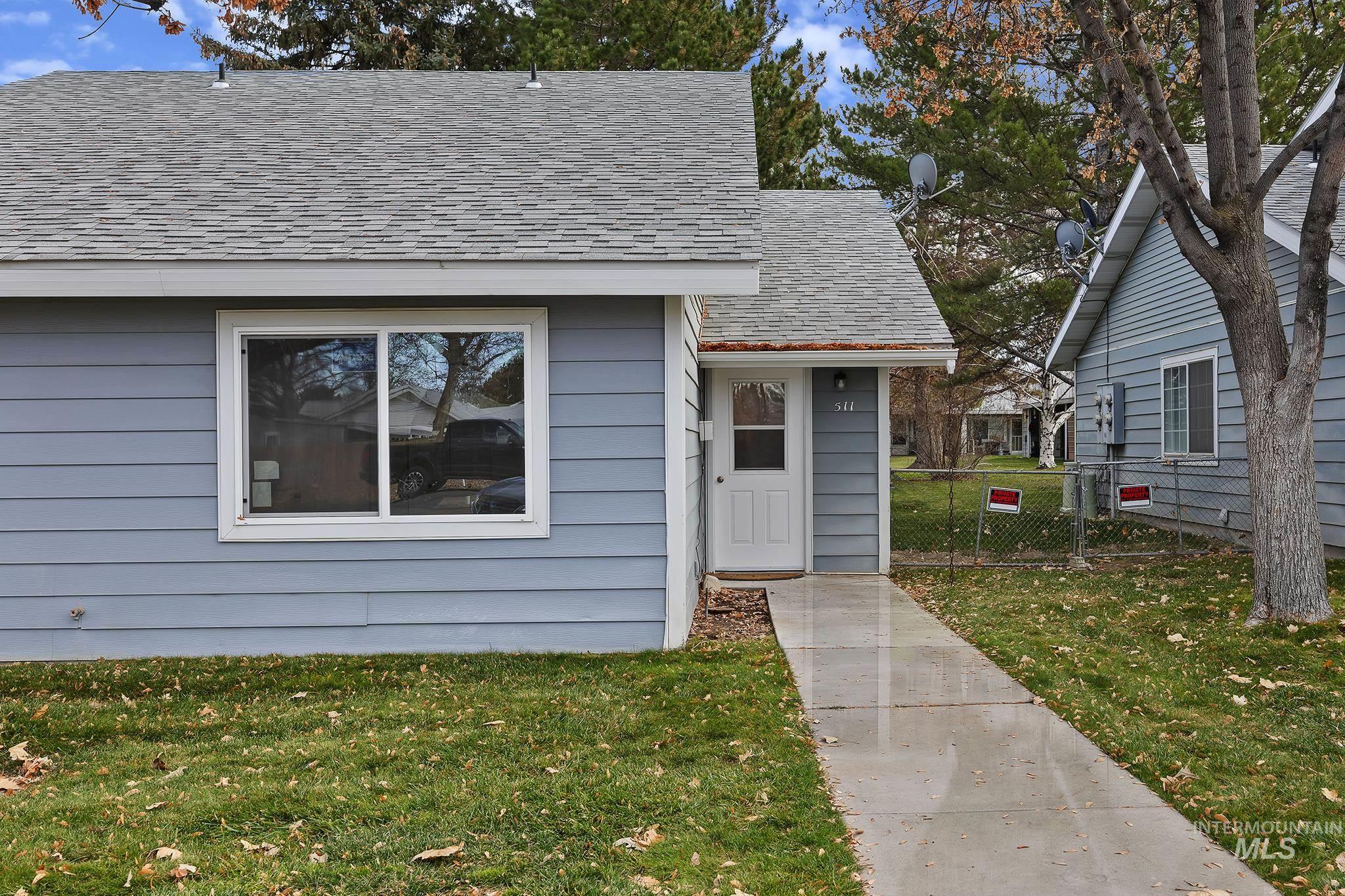 View of front of house featuring a shingled roof