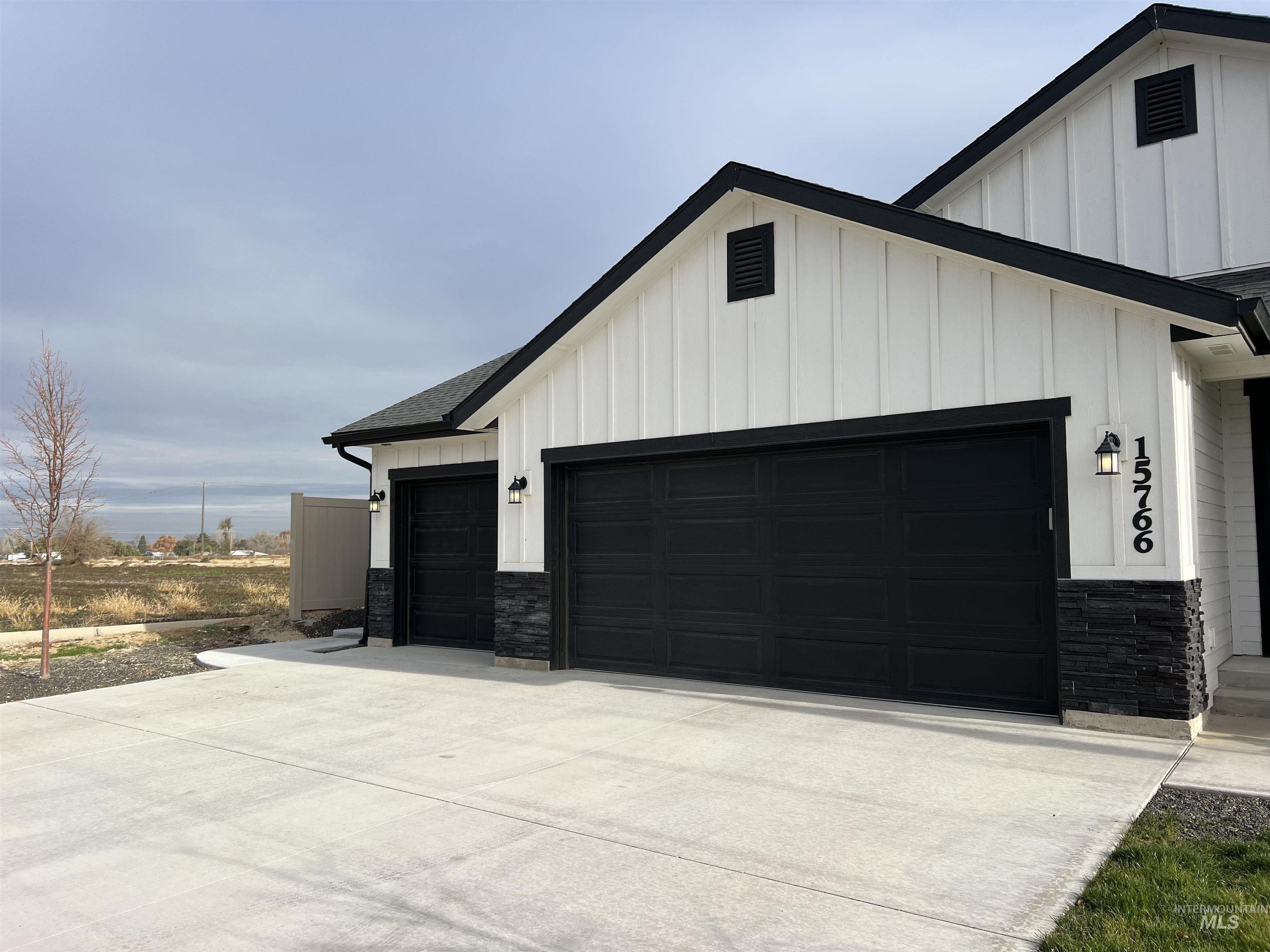 Garage with concrete driveway