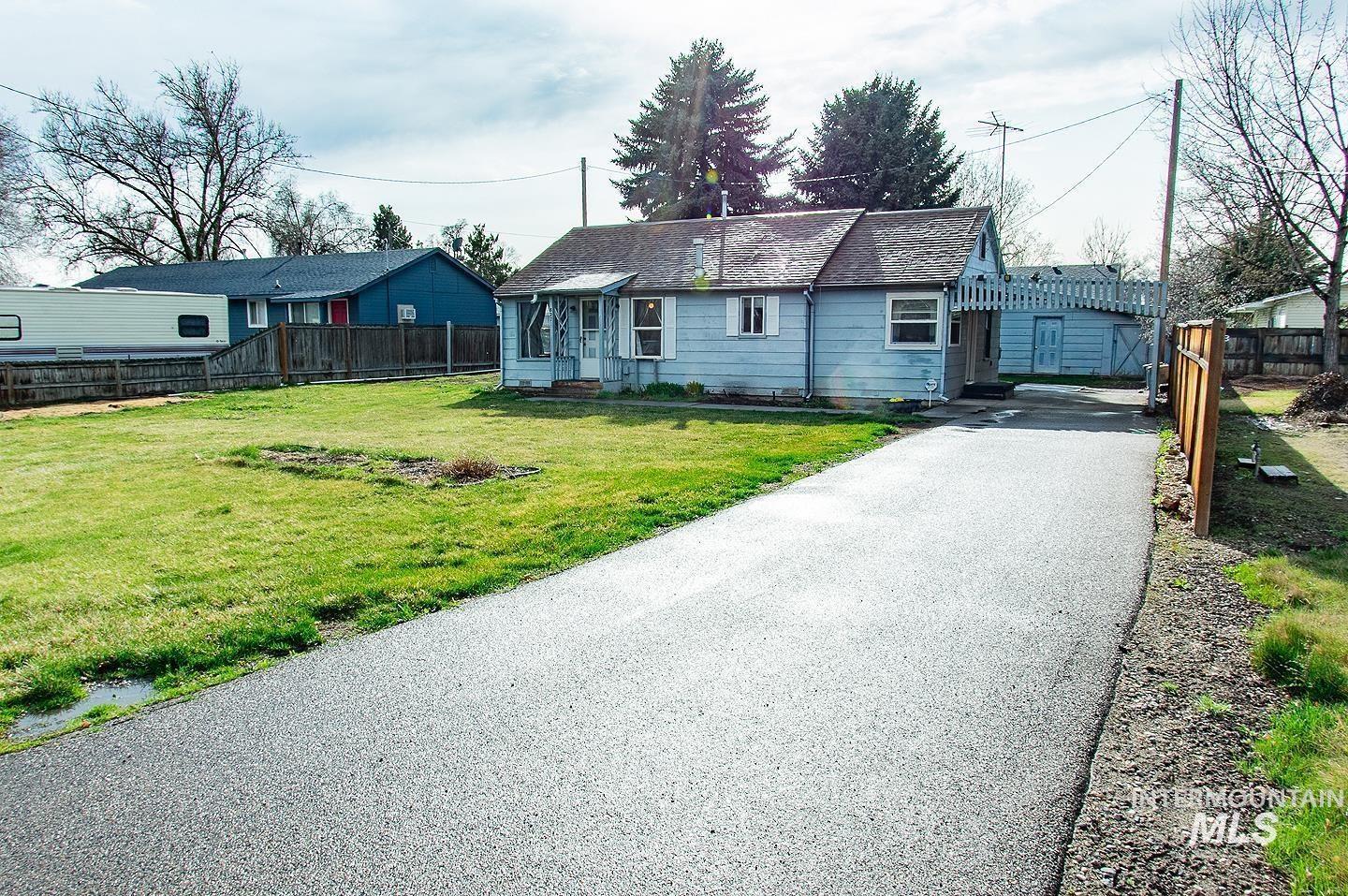 View of front of property featuring driveway
