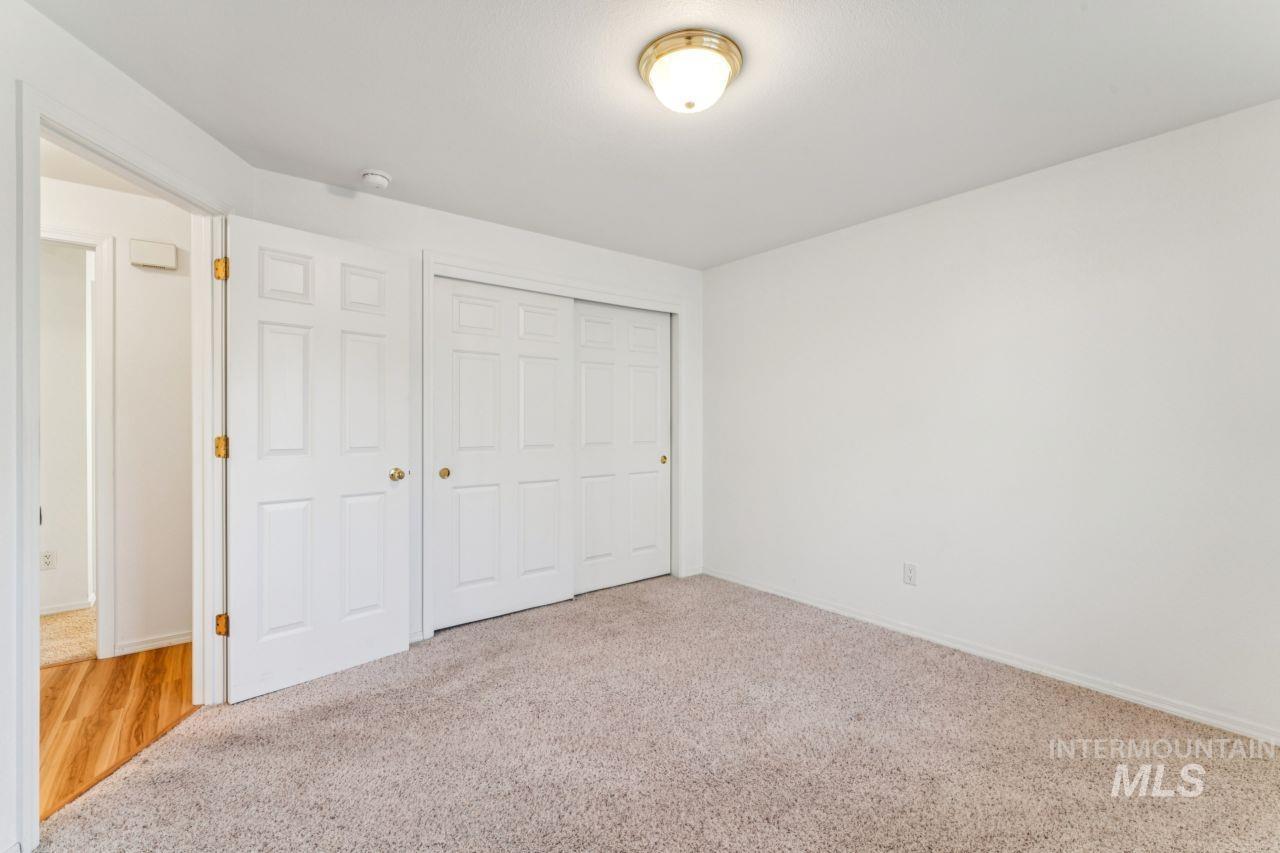 Unfurnished bedroom featuring carpet floors and a closet