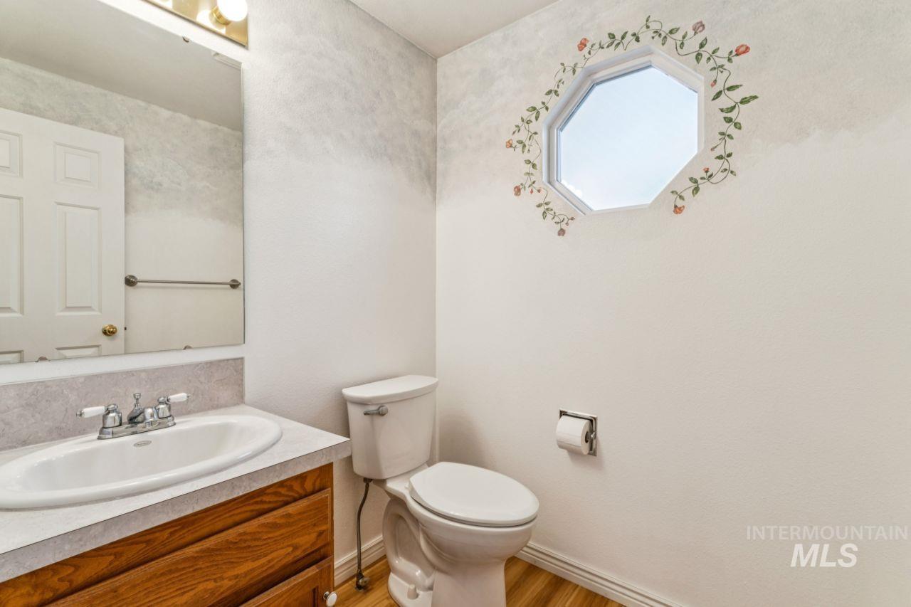 Bathroom featuring vanity and light wood-style floors