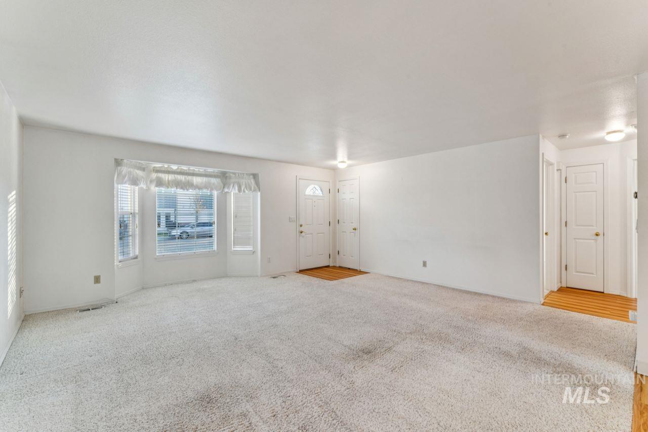 Empty room featuring carpet flooring