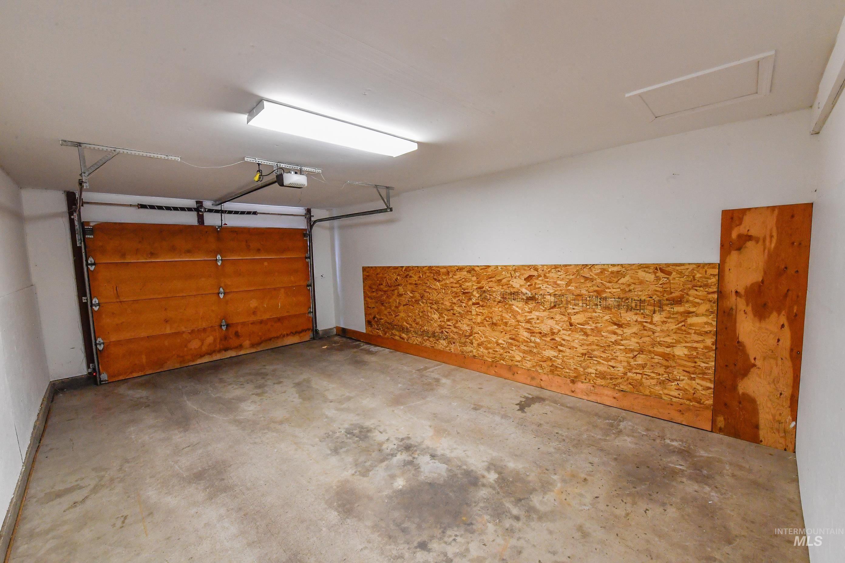 Garage featuring a garage door opener