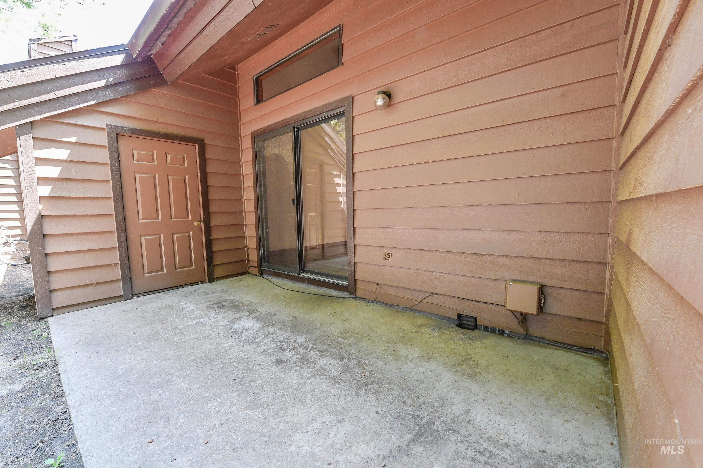 Entrance to property featuring a patio