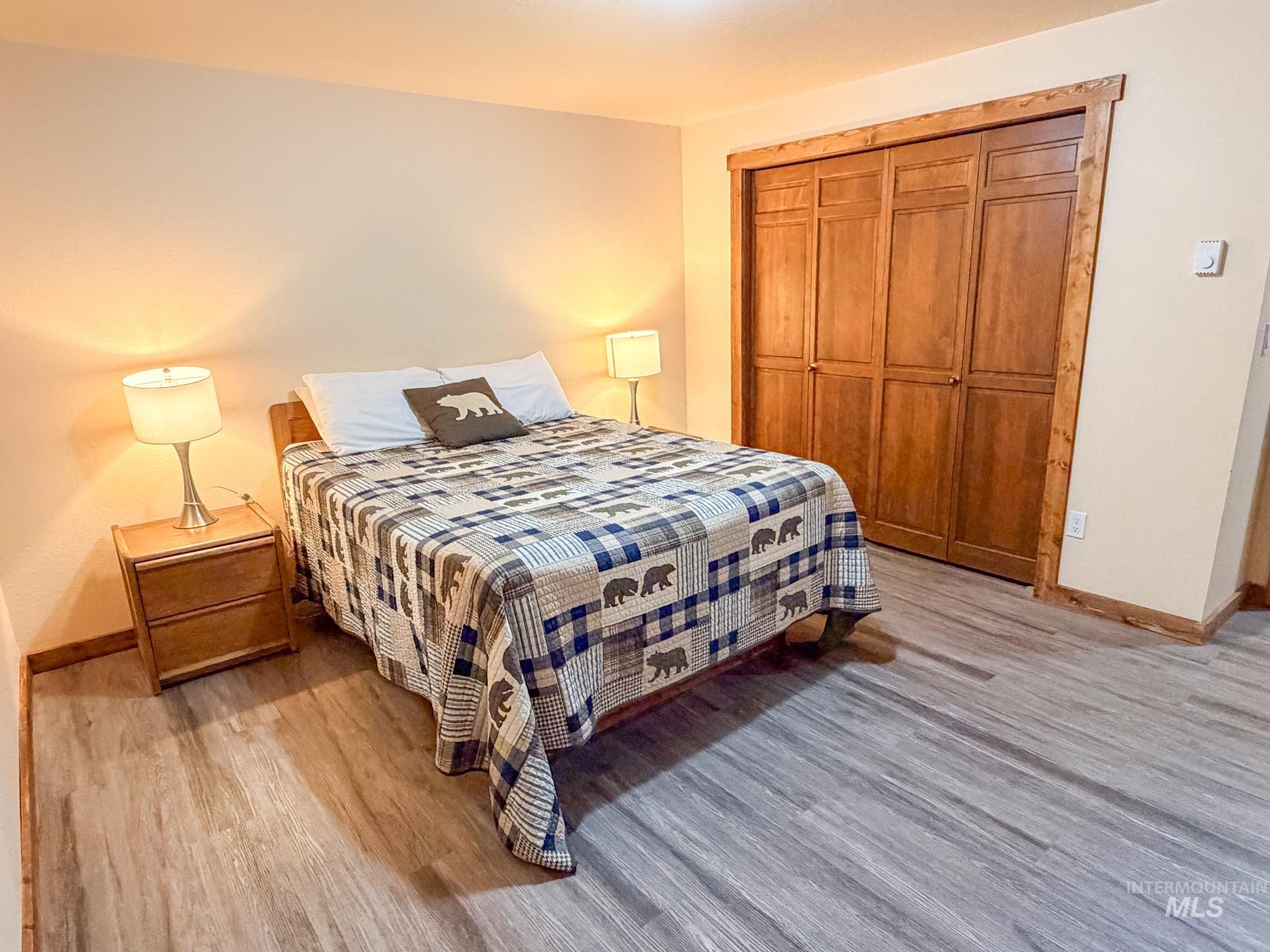 Bedroom featuring a closet and light wood-type flooring