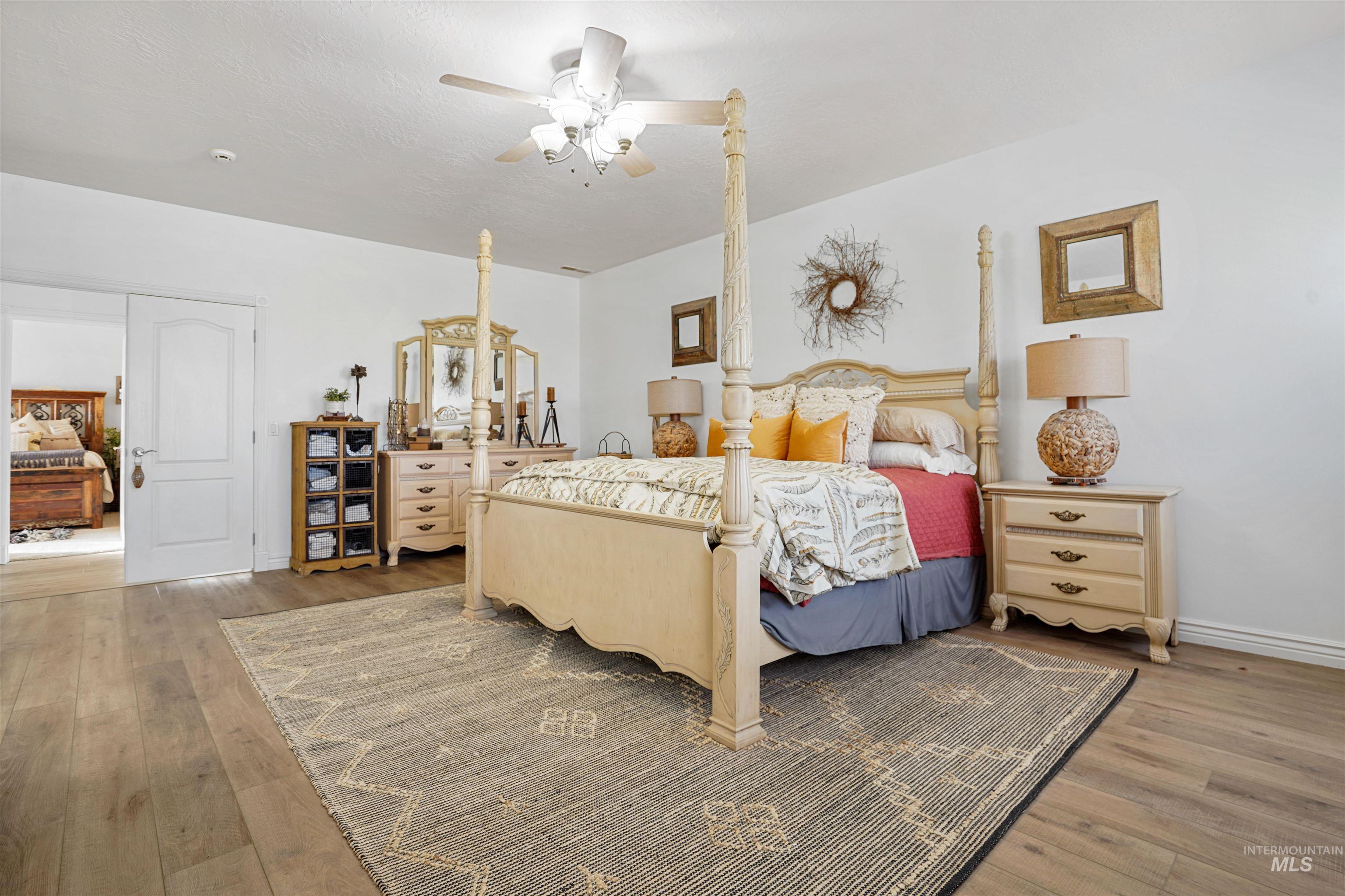 Bedroom featuring light wood-style flooring and ceiling fan