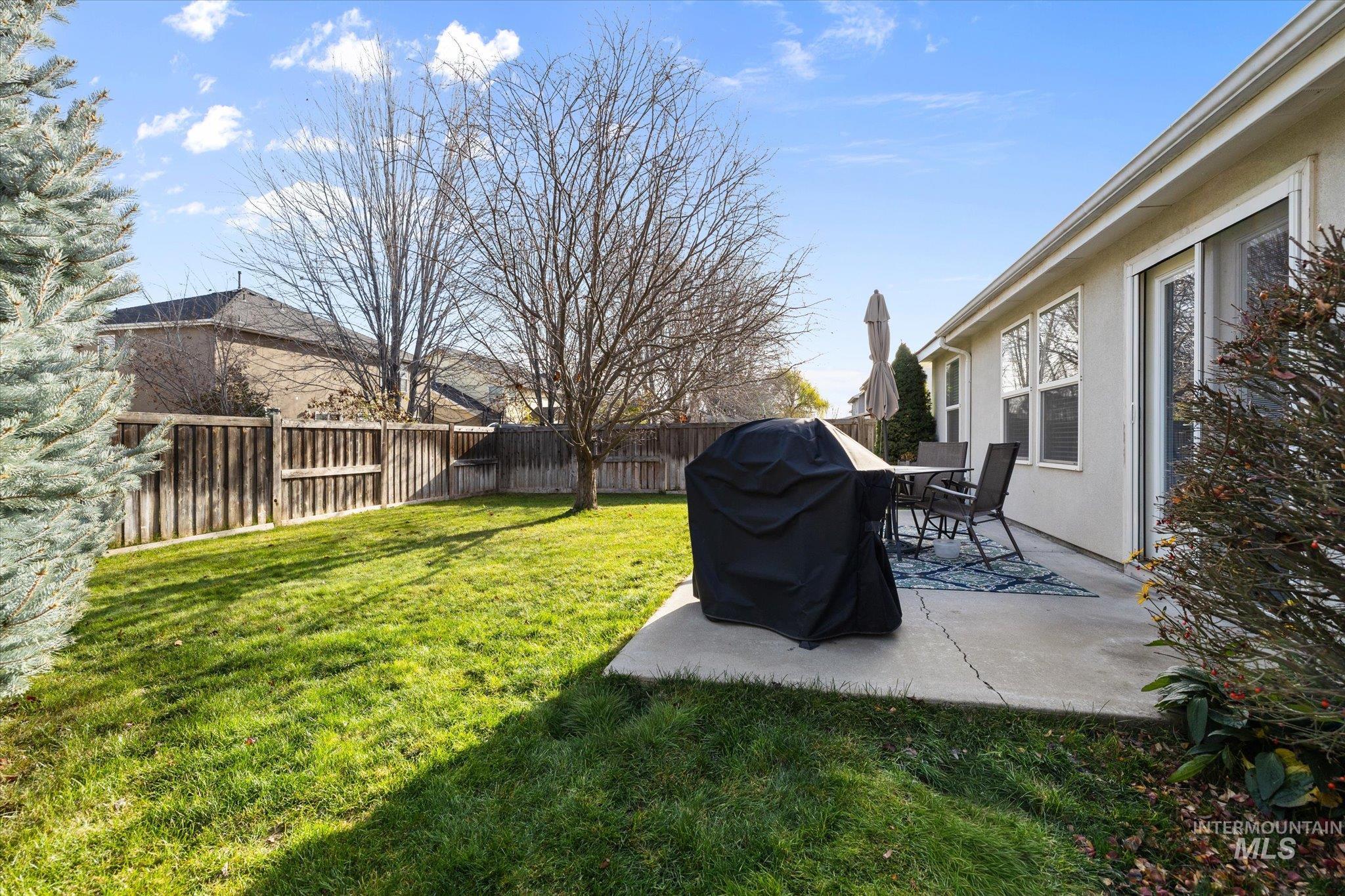 Fenced backyard featuring a patio area