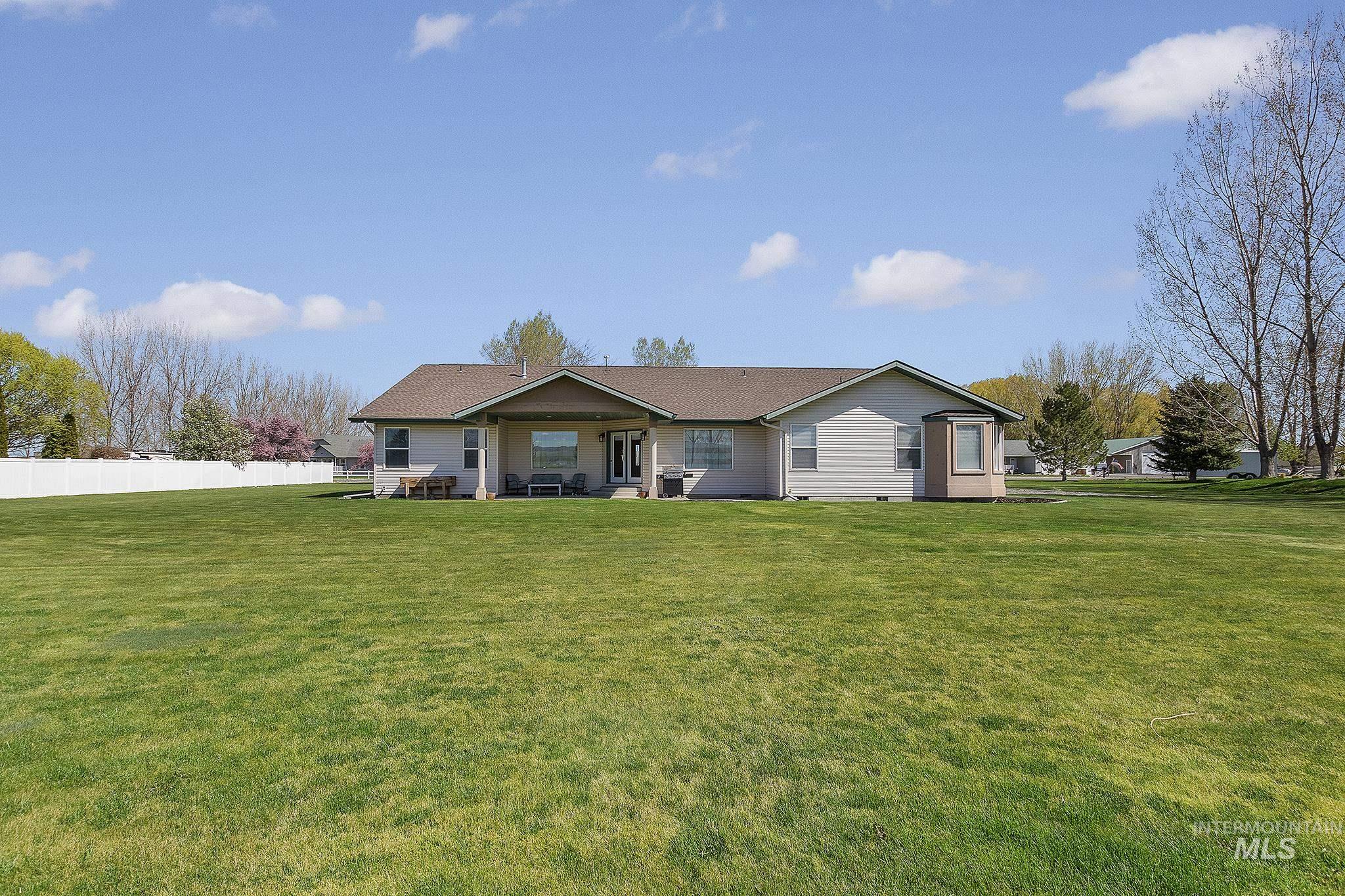 View of front of home featuring crawl space and a patio