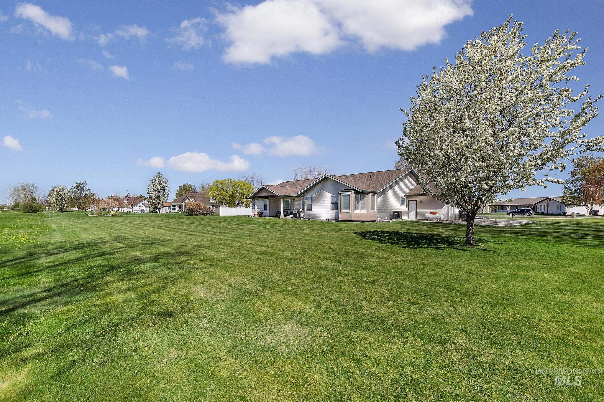 View of front of house with a front lawn and a residential view