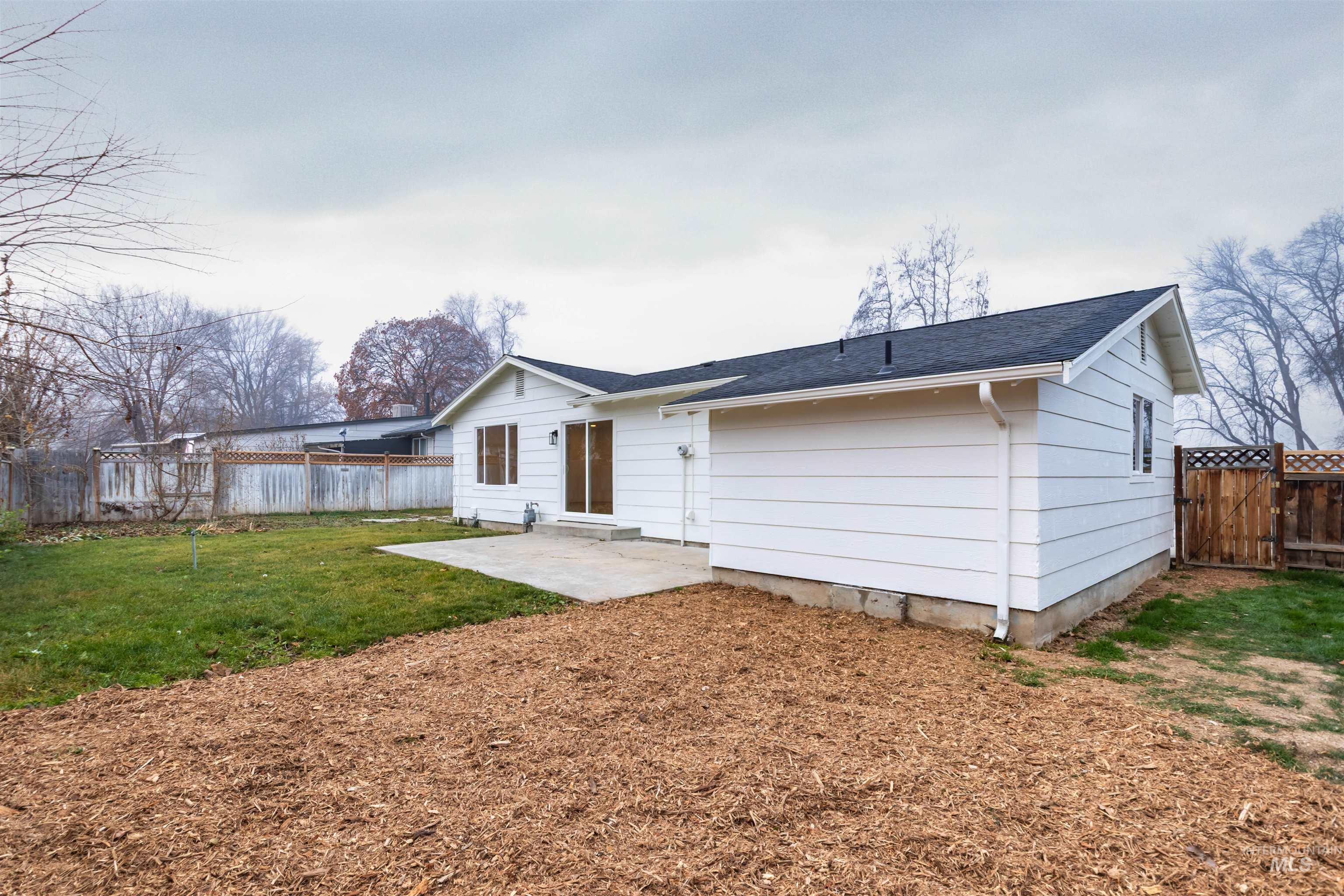 Rear view of property with a patio area
