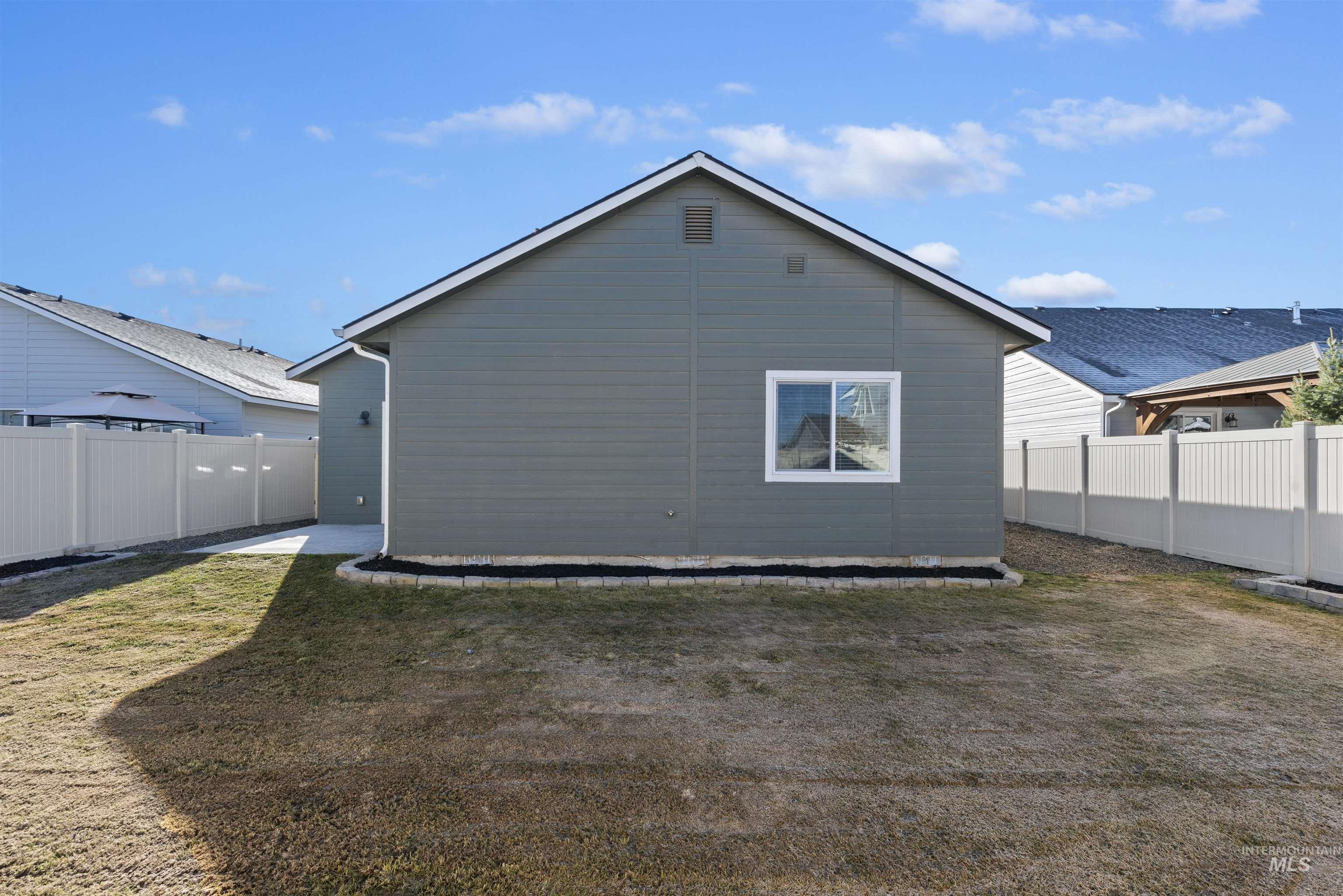 Back of house featuring a fenced backyard
